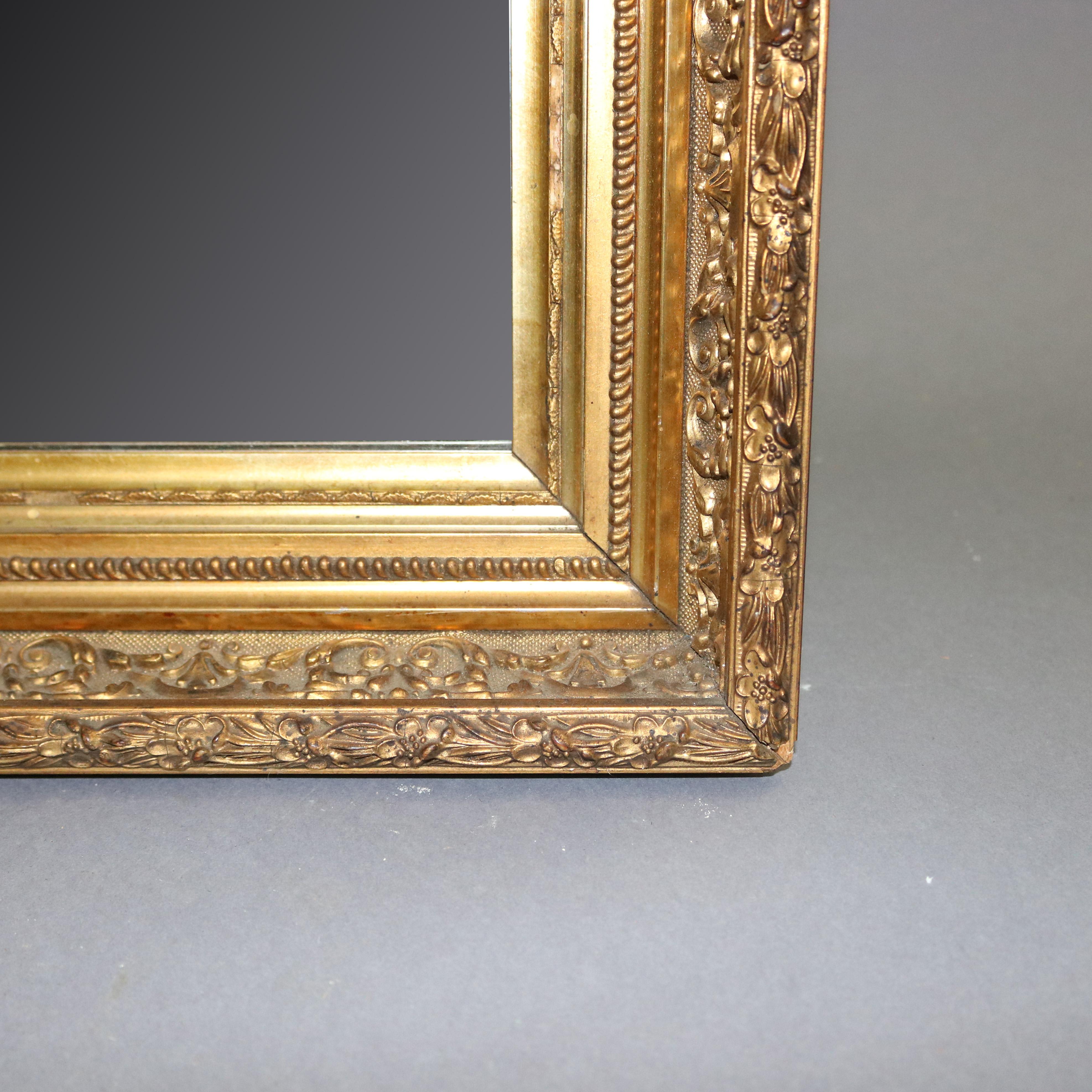 An antique French first finish giltwood framed mirror offers foliate and floral relief pattern surround, 19th century 

***DELIVERY NOTICE – Due to COVID-19 we are employing NO-CONTACT PRACTICES in the transfer of purchased items.  Additionally, for