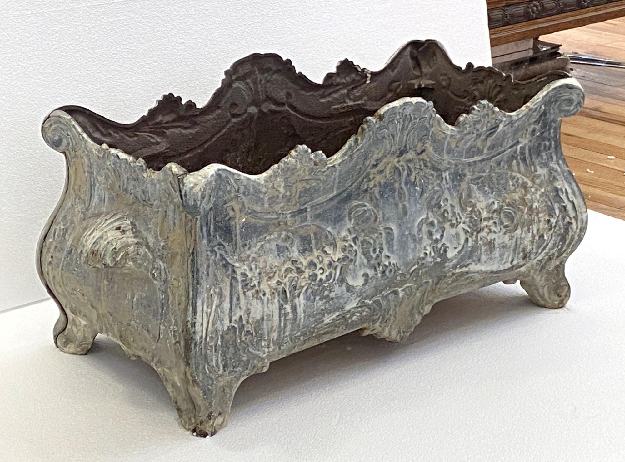 Late 18th century cast iron French planter with a foral design. Rectangular with the original patina. This can be seen at our 333 West 52nd St location in the Theater District West of Manhattan.