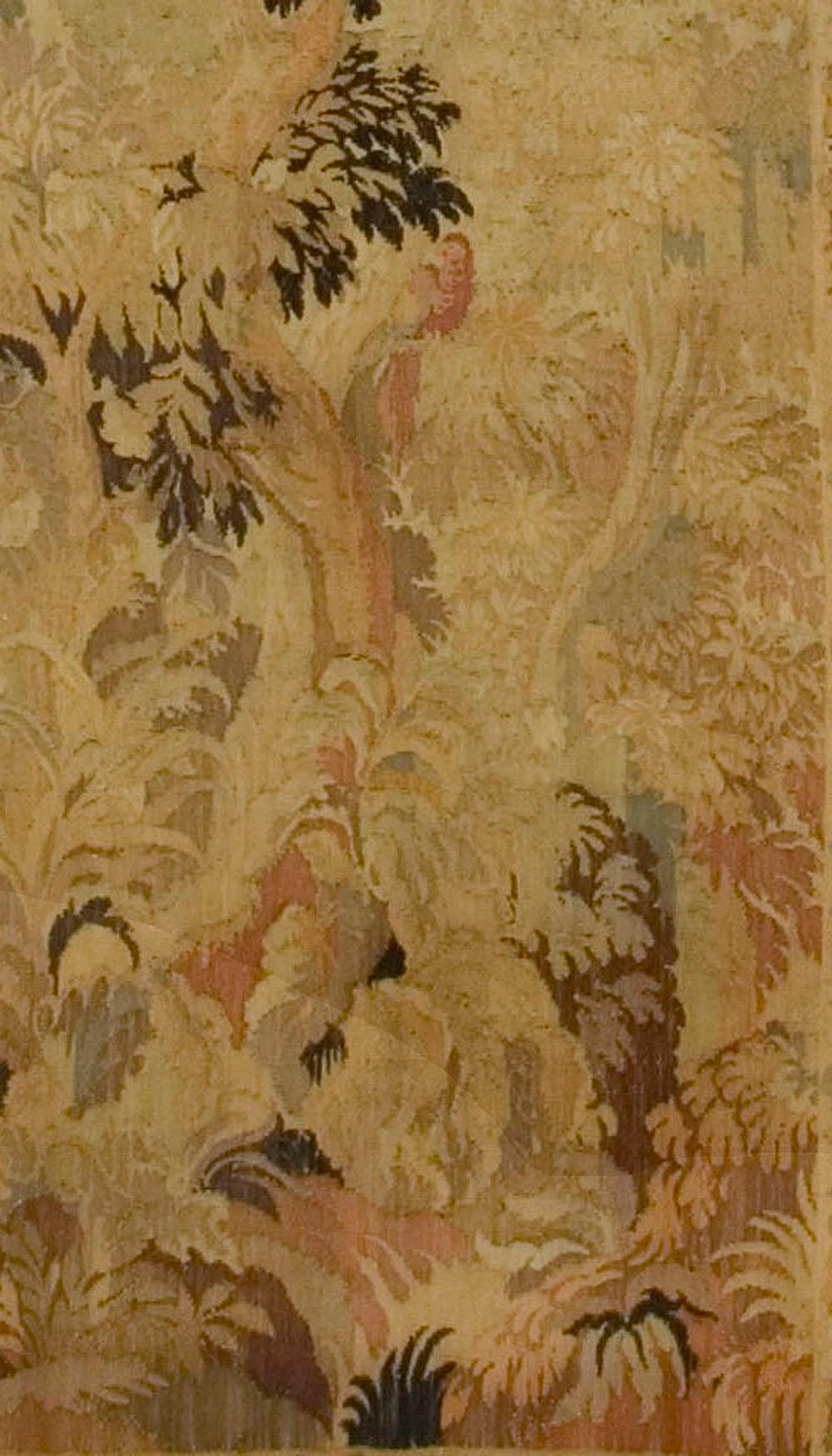 Antique French Forest scene tapestry, circa 1880, 4'6 x 10'. An antique French fine hand-loomed tapestry, circa 1880. A forest scene, with trees and foliage surrounded by a floral border.