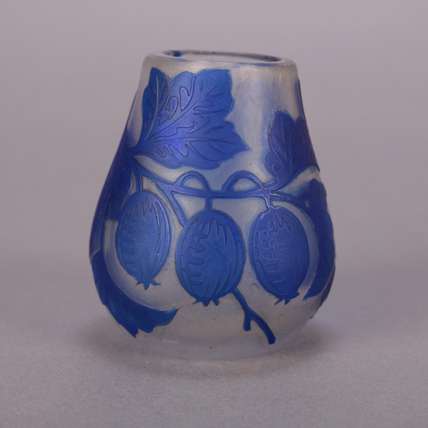 Antique Art Nouveau French Galle School art glass vase features cut back fruit and vine design in cobalt blue, circa 1920.

Measures: 3