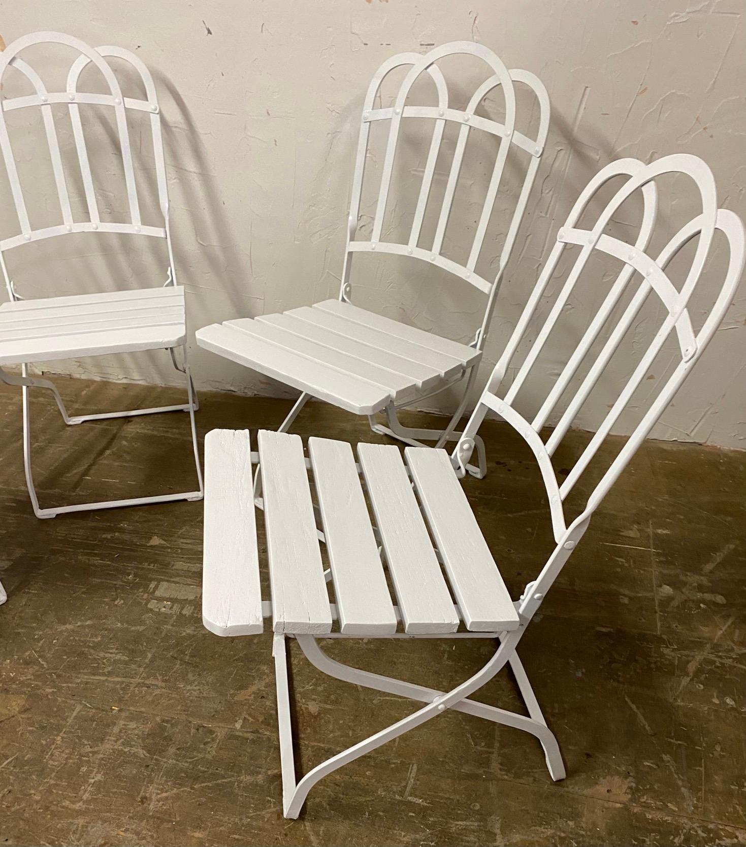 Say it with style with this set of 4 antique French folding bistro style dining chairs. Leave them out or fold them up to save space. Great dining chairs for the porch, garden or patio.