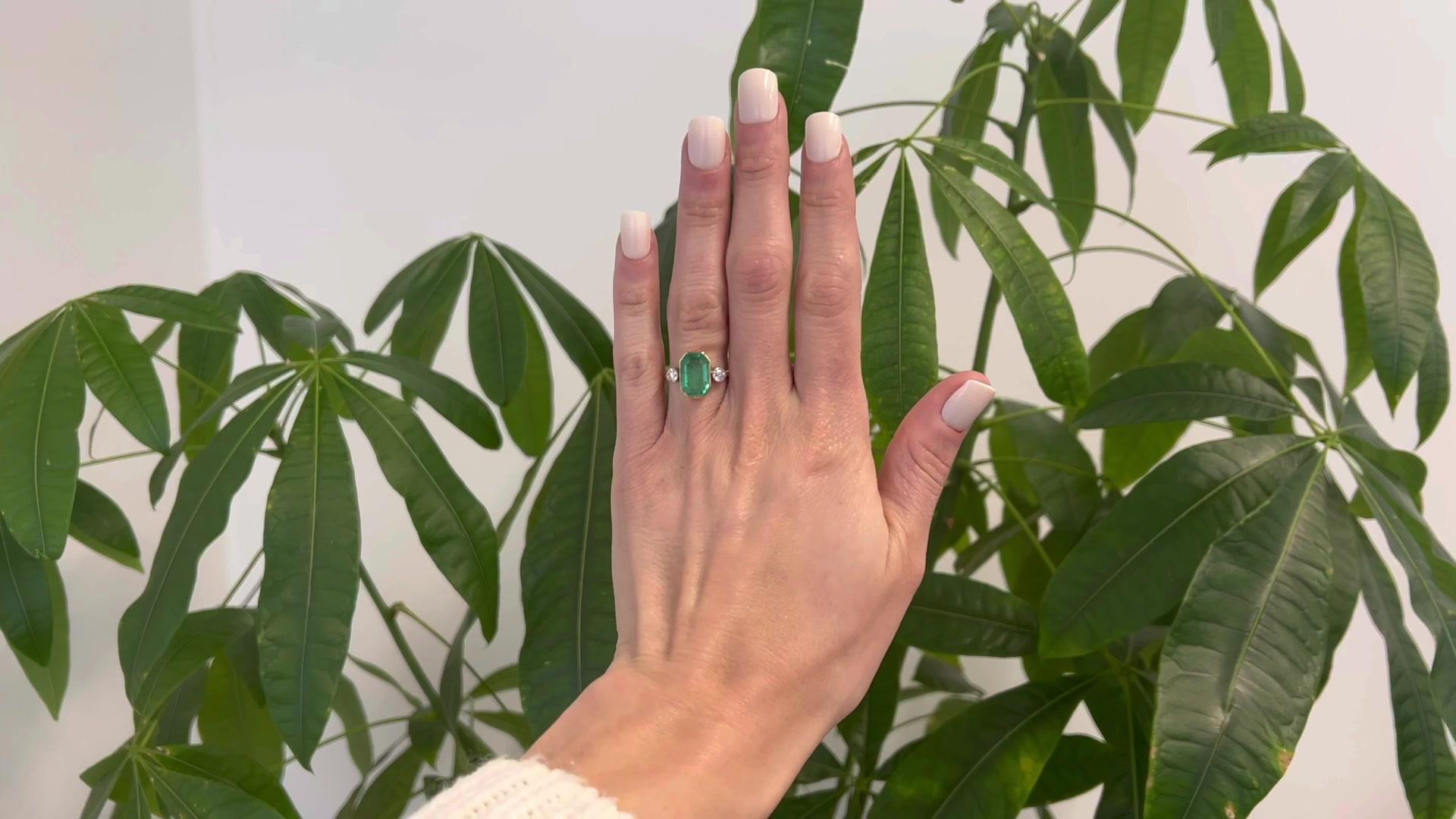 One Antique French GIA Russian Emerald Diamond 18k Yellow Gold Platinum Three Stone Ring. Featuring one octagonal step cut emerald weighing approximately 3.70 carats, accompanied with GIA #5221764342 stating the emerald is of Russian origin.