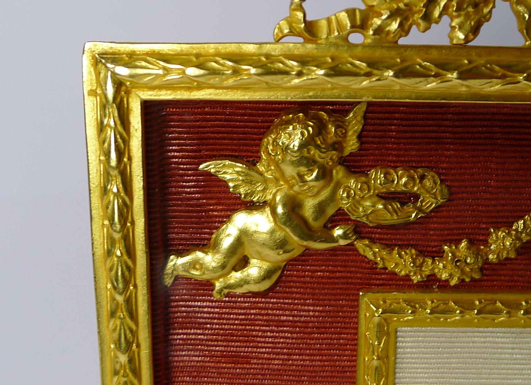 A stunning French Ormolu photograph frame dating to circa 1900 having been fully restored to it's former glory; the bronze smothered in gold.

Glass covers the entire front with the central picture aperture measures 3 1/2