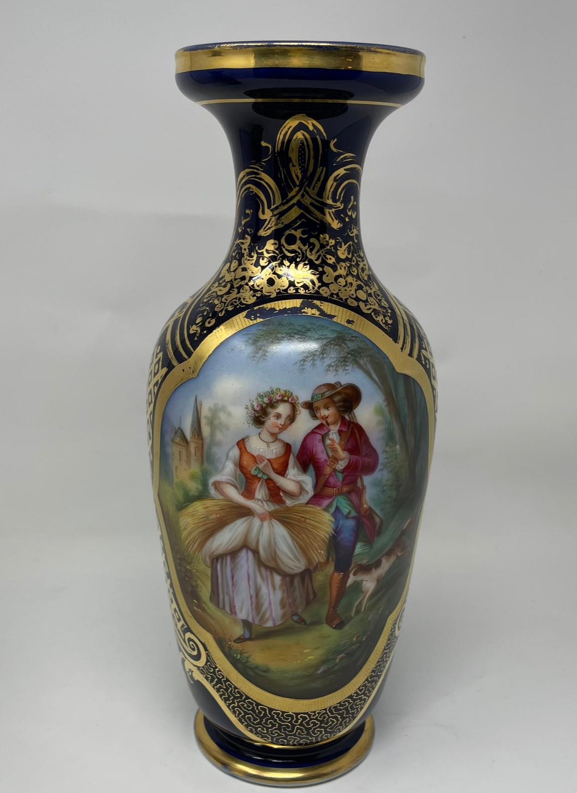 Antique French Old Paris Gilded Porcelain Vases with Hand Painted Courting Scenes - Pair

This beautiful pair of Porcelain Gilded Vases from France have a hand painted courting scenes. Both painted in a beautiful cobalt blue and has gold accents.