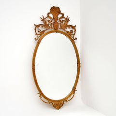 Miroir ancien en laiton doré