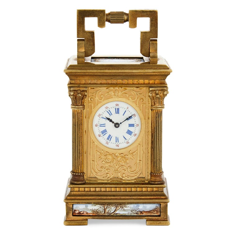 Antique French gilt bronze and enamel miniature carriage clock
French, late 19th Century
Clock: Height 11cm, width 5.5cm, depth 5cm
Case: Height 11cm, width 7cm, depth 7cm

This small and elegant gilt bronze carriage clock is crafted in the