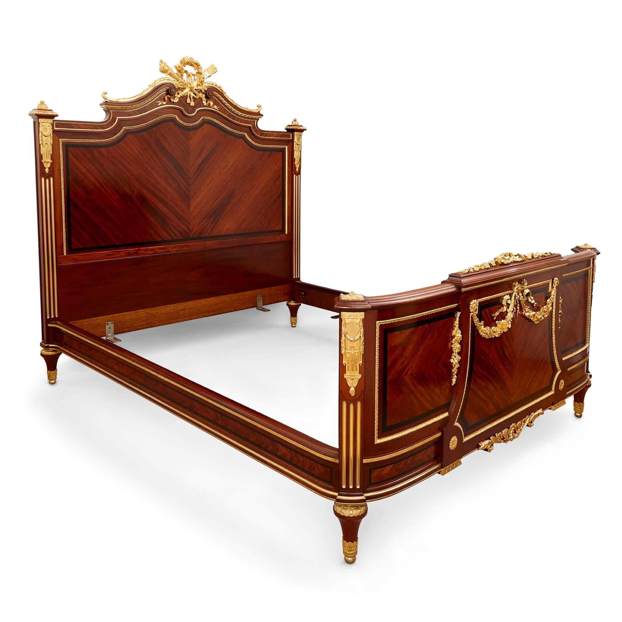 Antique French gilt bronze and mahogany bed by Paul Sormani 
French, c. 1870 
Height 178cm, width 176cm, depth 214cm

Decorated with various ormolu (gilt bronze) mounts and beautifully crafted from mahogany, the bed was made in France by Paul Sormai
