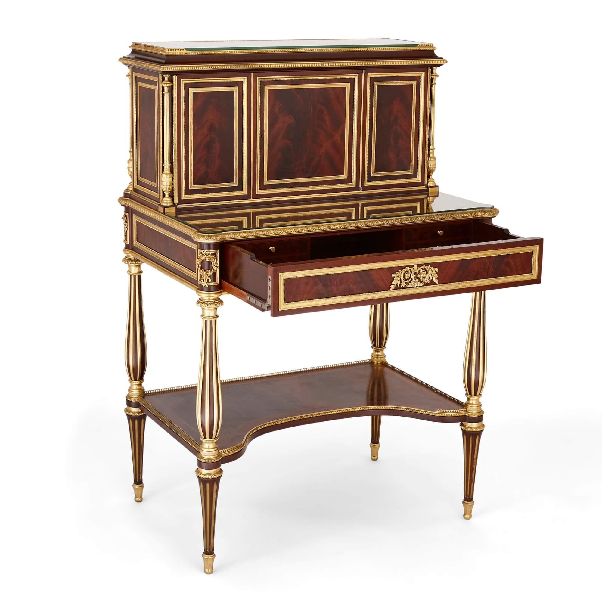 Antique French gilt bronze and mahogany bonheur du jour 
French, Late 19th Century 
Height 117cm, width 78cm, depth 54cm

Made in France in the late 19th century, this elegant bonheur du jour is made from a selection of high quality materials. This