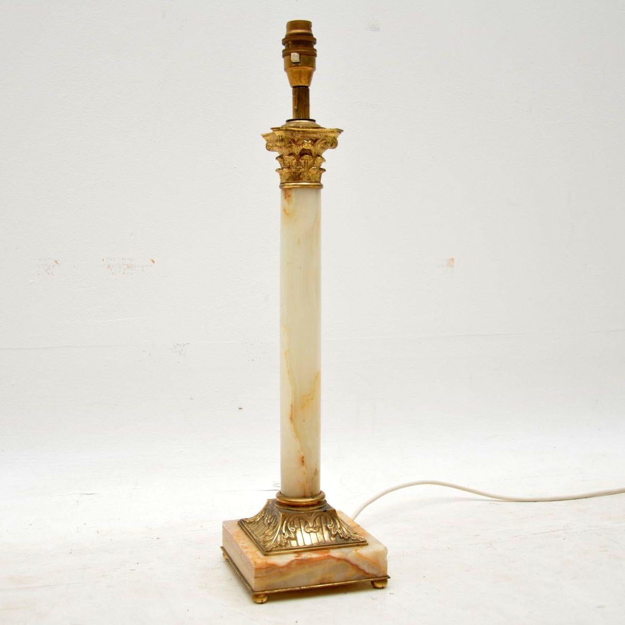 Antique marble and gilt bronze table lamp in a neoclassical style and in excellent condition. It’s just been re-wired and I would date this lamp to around the 1910-1920s period. The gilt bronze parts have some Fine intricate details on the base part