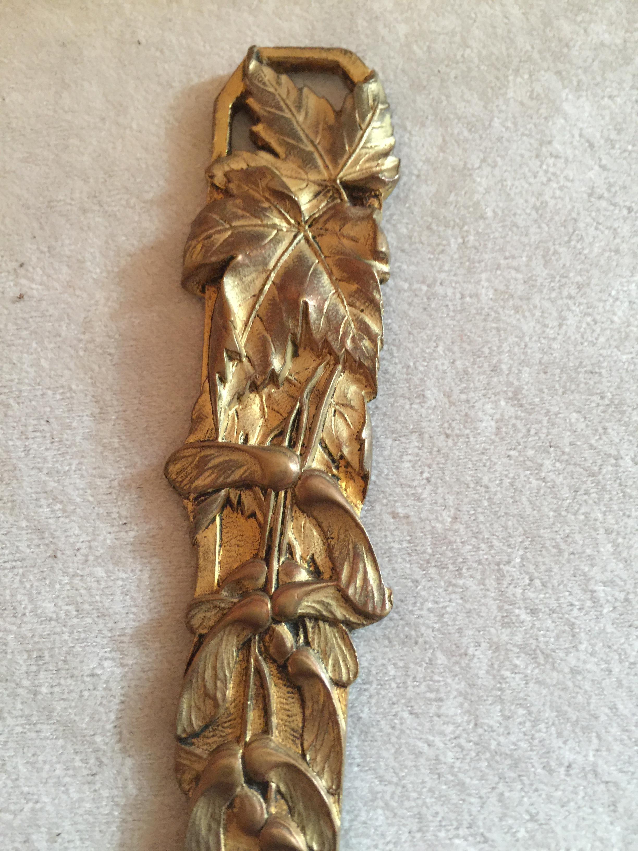 We bought a wonderful collection of letter openers, and this is one of our choicest example. Displaying a real commitment to the Art Nouveau movement, and finished in a rich gilt. The floral design is very stylized and symbolic of art nouveau.
A