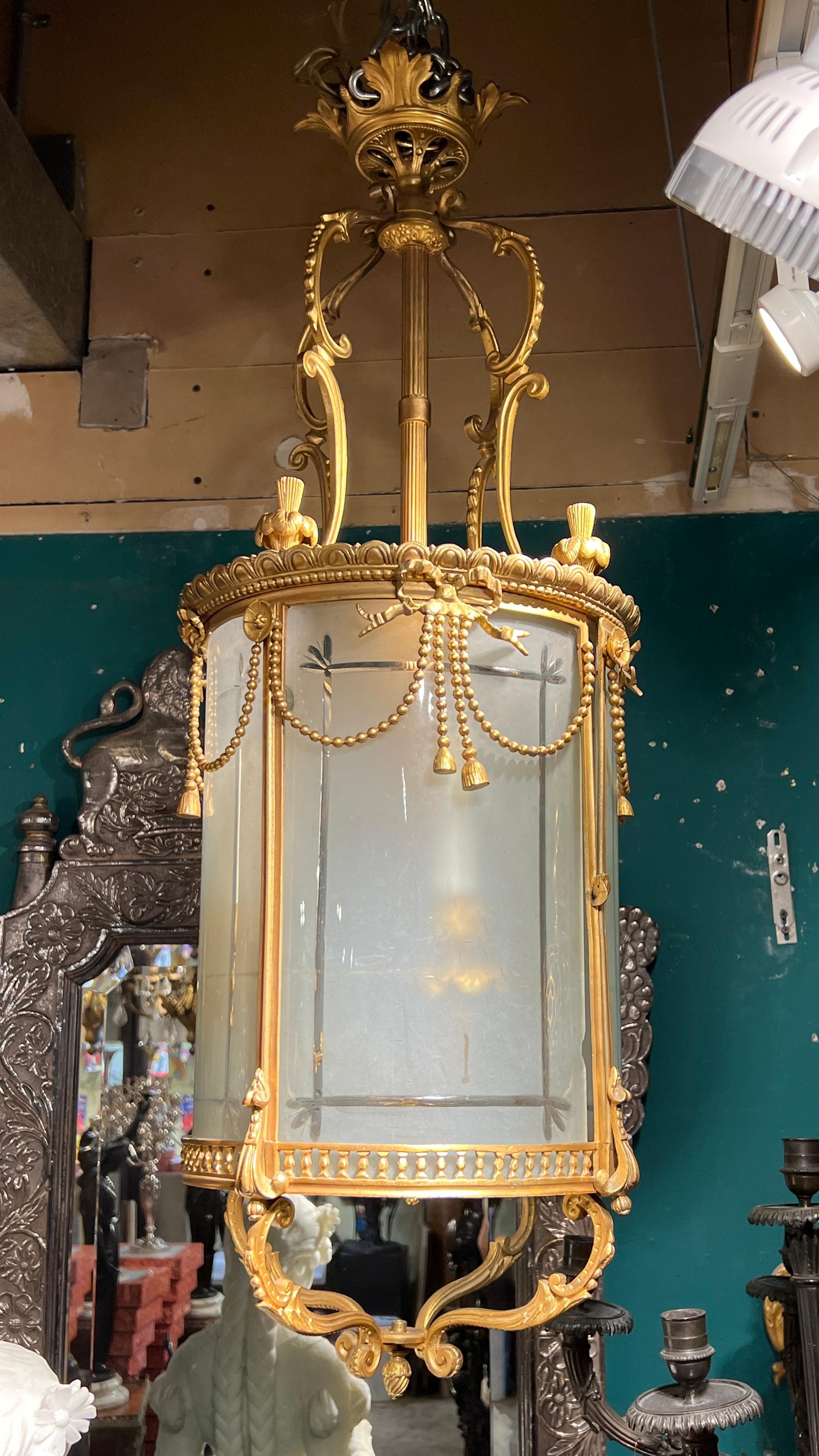 Antique gilt bronze lantern in the  Louis XVI  style with frosted glass panes and electrified sockets, ready for use.