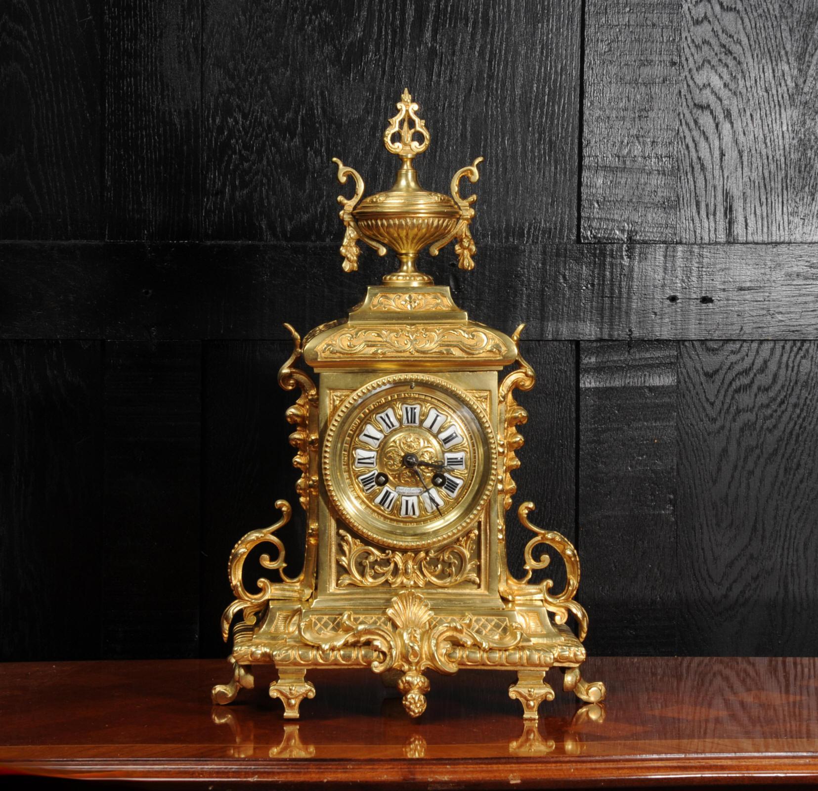 A beautiful original antique French clock, dating from circa 1870. It is in the Louis XVI style, elegantly decorated with acanthus and a large urn to the top. To the front is a panel with blind fret work of acanthus. The rear door is glazed to allow