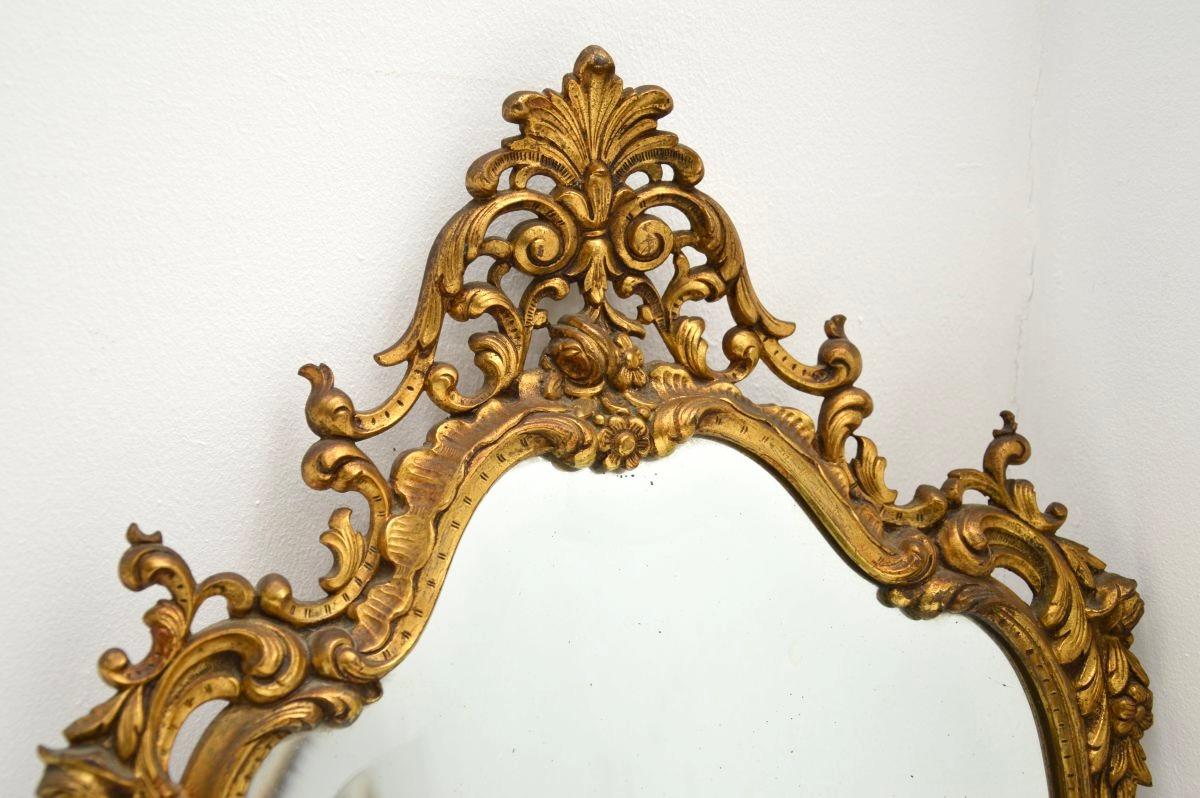 A stunning and extremely well made antique French gilt bronze mirror, dating from around the 1900-1920 period.

This is of outstanding quality, it is fairly petite and would be useful in a variety of settings. It is in the classic Rococo style, with