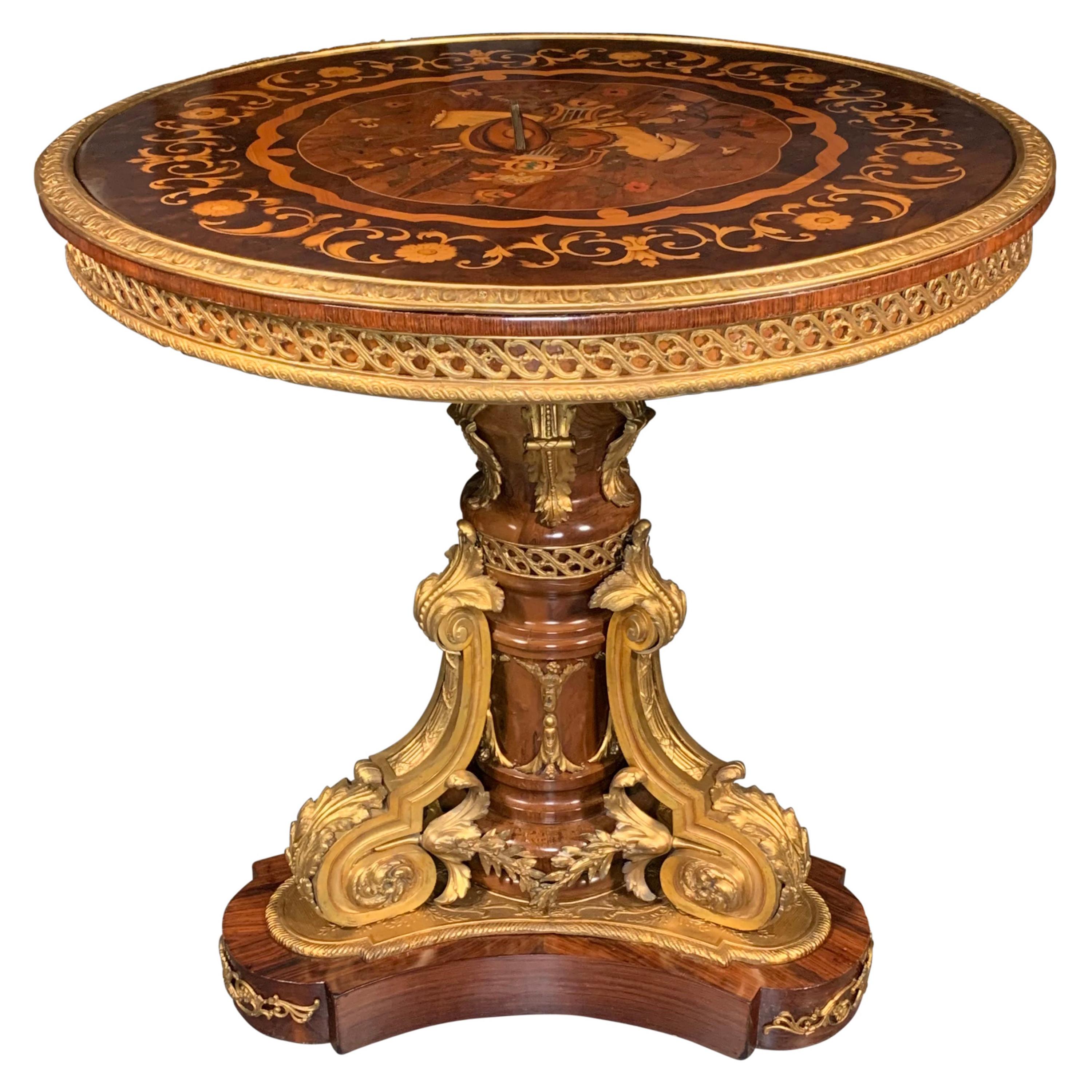 Table centrale circulaire de style Louis XV montée en bronze doré et marquetée