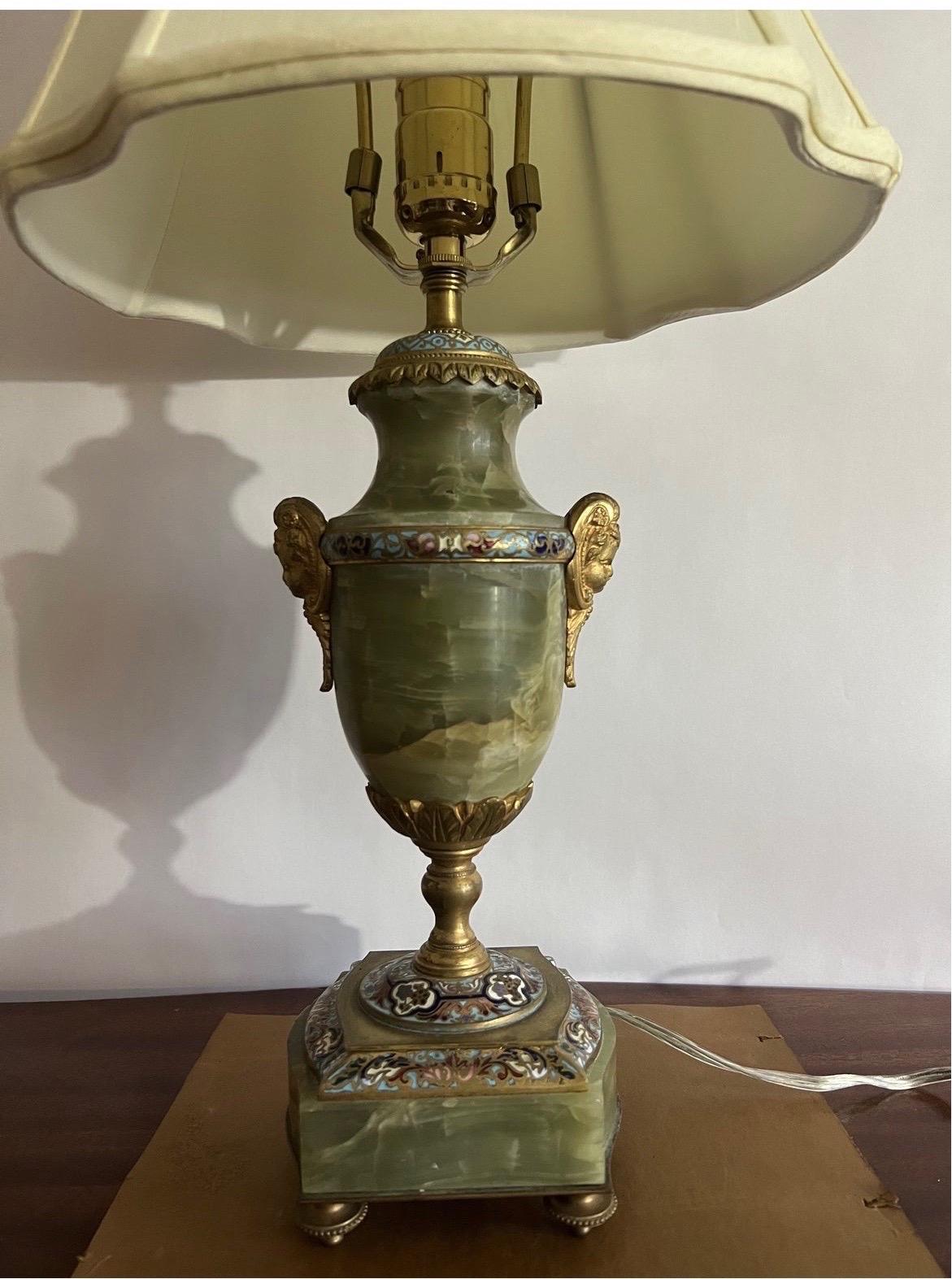 Beautiful HEAVY table lamp with green onyx stone, gilt bronze mounts depicting cherubs and multi colored french champleve enamel to body. Marked “France” to bottom
21” measurement includes harp/finial.