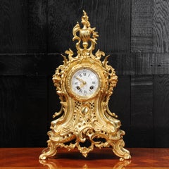 Pendule rococo française ancienne en bronze doré