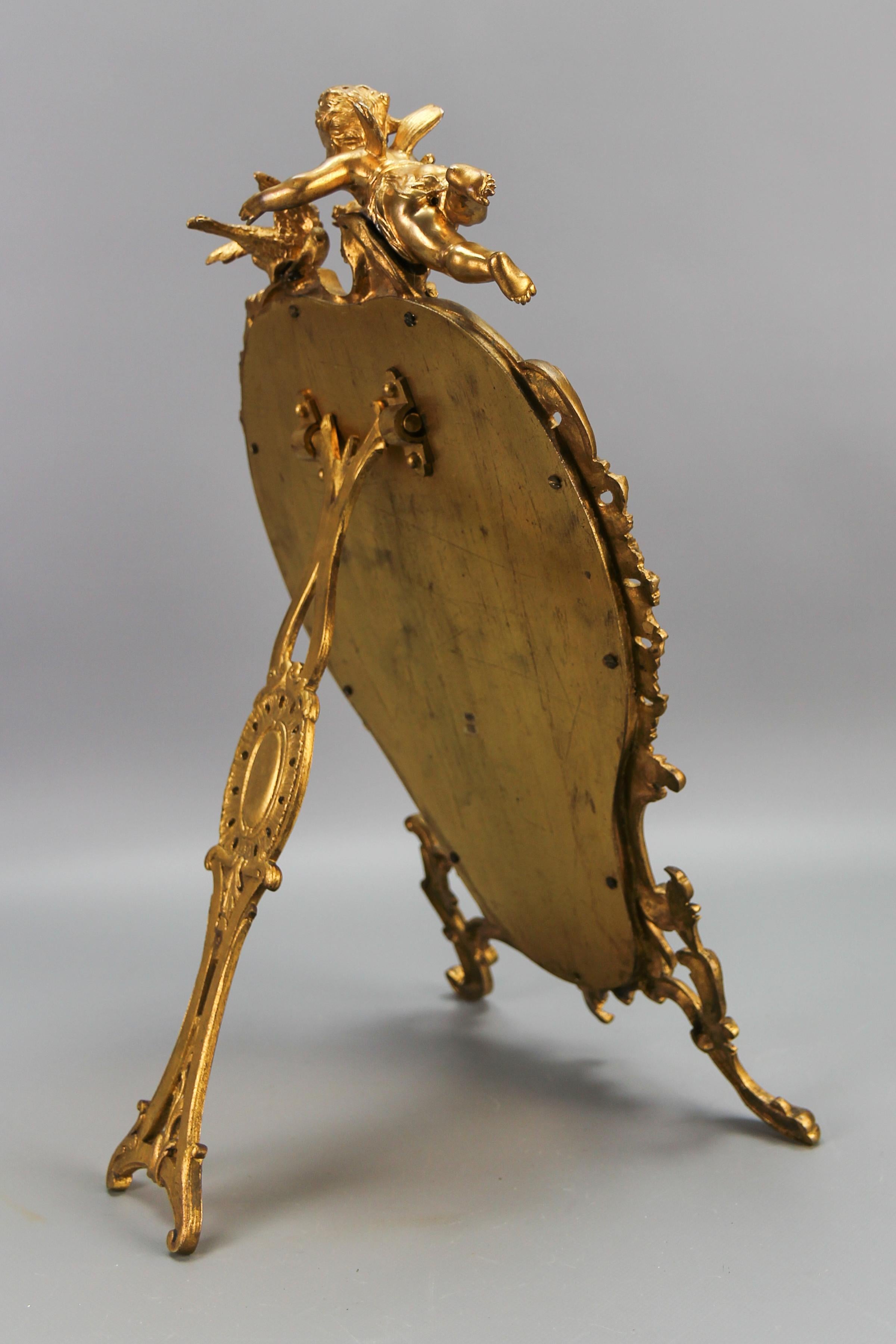 Brass Antique French Gilt Bronze Rococo Style Desktop Mirror with Cherub and Bird For Sale