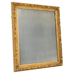 Miroir français ancien encadré et doré