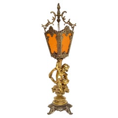 Antike französische Cherub-Lampe aus vergoldetem Metall und Glas
