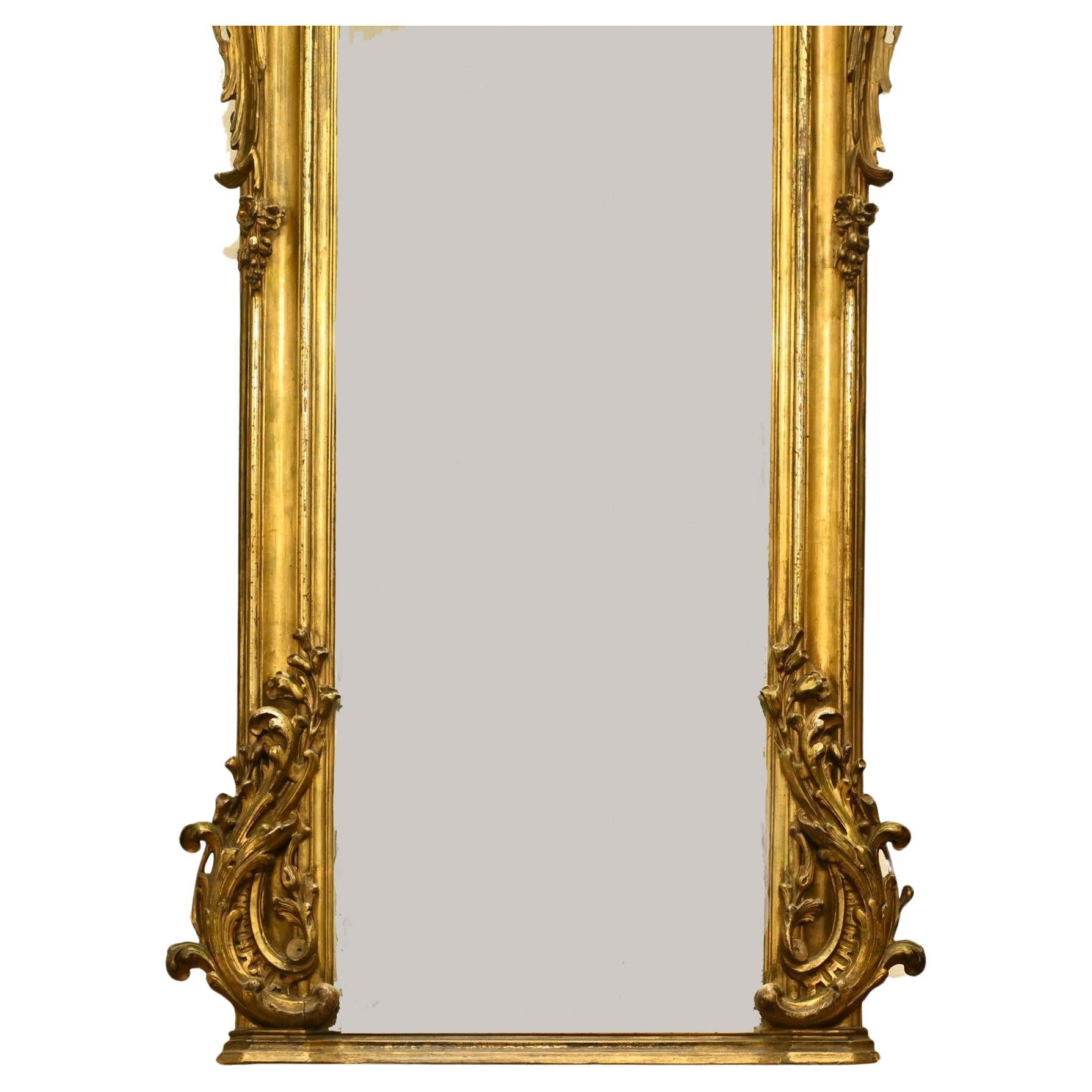 Gorgeous antique French gilt pier mirror
Good size at almost six feet tall - 172 CM
Very ornate frame with decoration to sides and top with rococo cartouche
Glass is clear and blemish free
Bought from a dealer at Marche Biron at Paris antiques