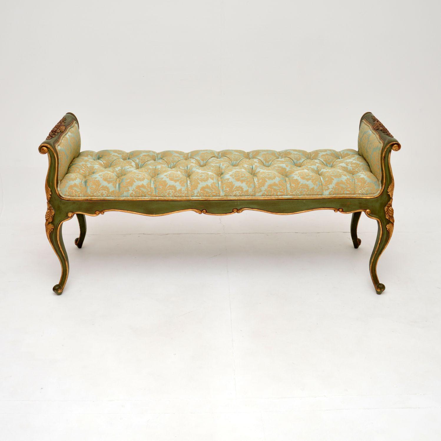 A stunning antique French gilt wood bench. We would date this to around the 1960-70’s and it’s in the classical French Louis style.

It is of superb quality and is a great size. The frame is beautifully carved, and is finished with a light green