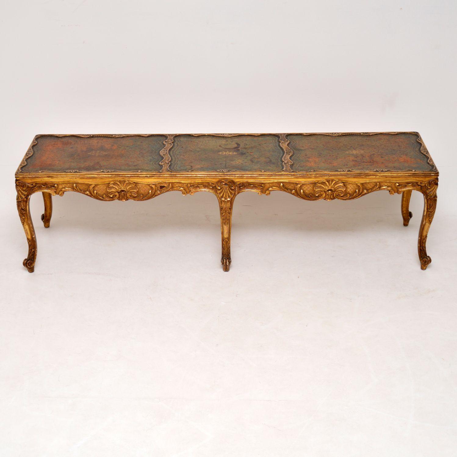 This antique giltwood coffee table is very fine quality and is in good condition with a wonderful original look. I believe it’s French or Italian, dating to circa 1910 period. The leather looks original and has beautiful gold tooling. It is worn and