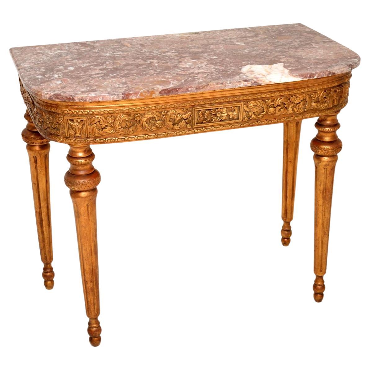 Ancienne table console française en bois doré avec plateau en marbre