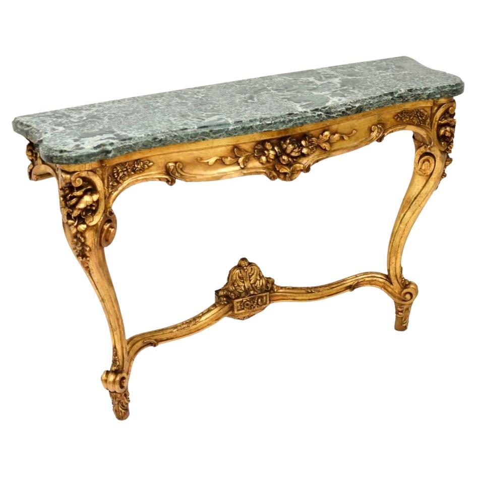 Consola de madera dorada francesa antigua con tapa de mármol en venta
