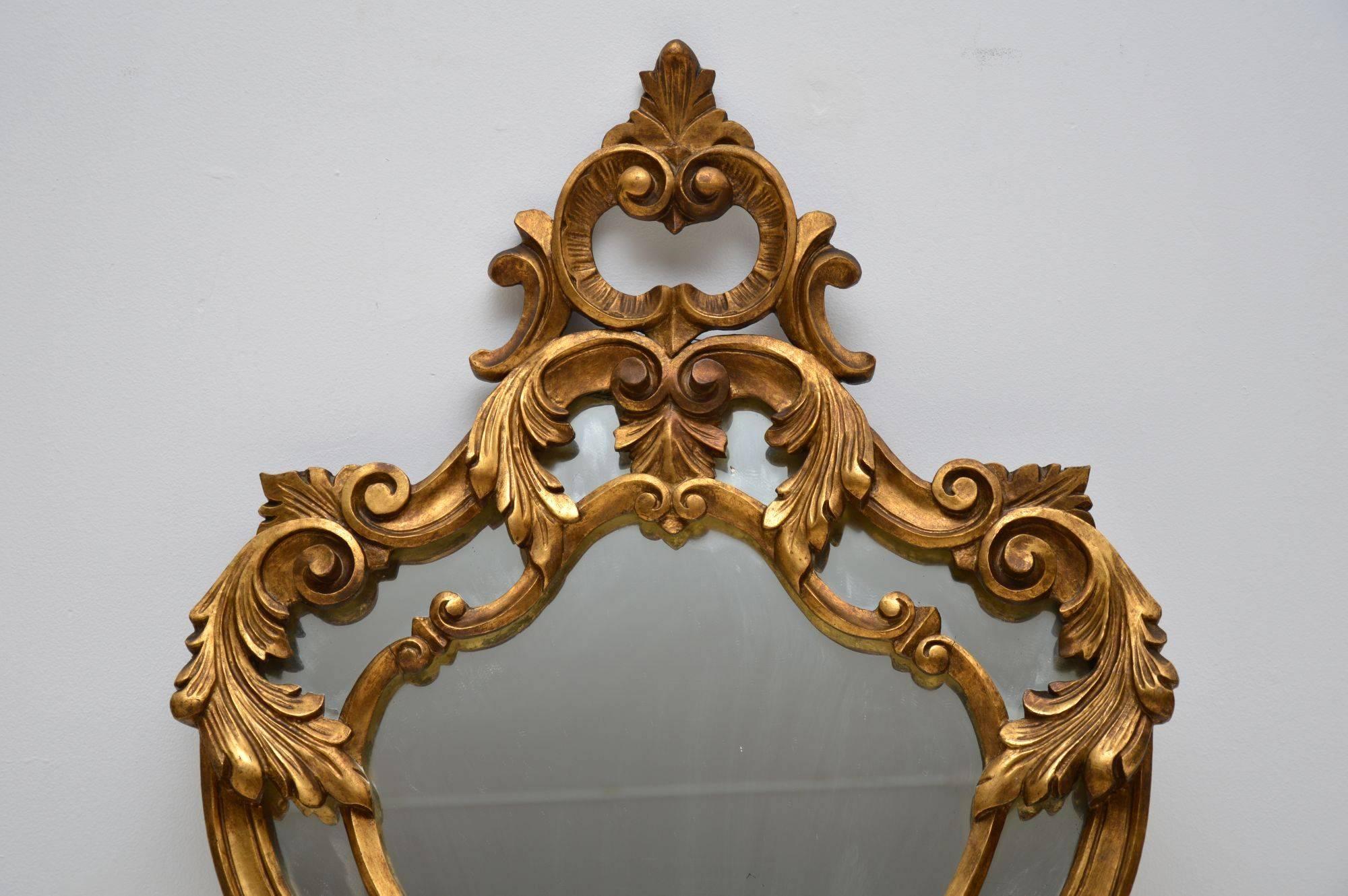 Antique giltwood mirror in good original condition with wonderful carving all over. It’s in excellent condition and I would date it to circa 1920s-1930s period. It could be French or Italian. The gilding has mellowed nicely with age and the mirror