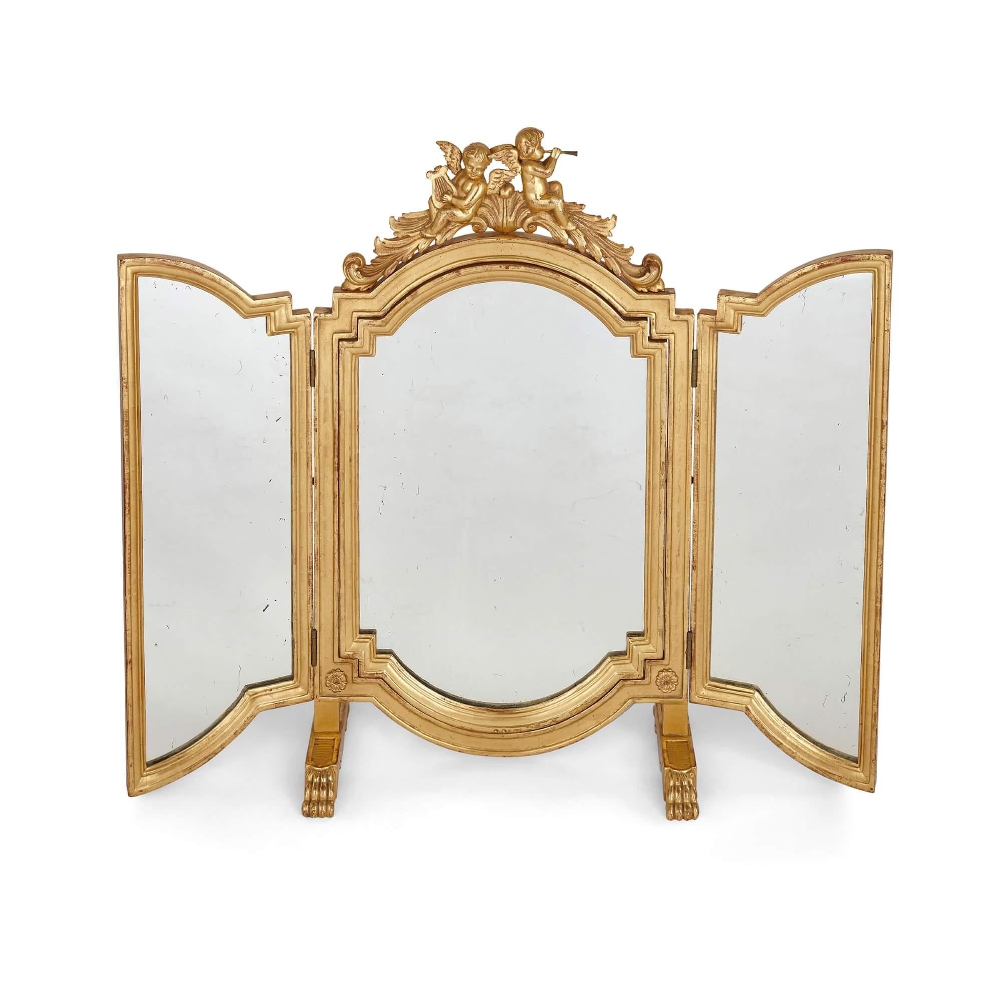 Antique French giltwood folding mirror
French, late 19th century
Measures: Height 80cm, width when open 97cm, width when closed 49cm, depth 23cm

This elegant giltwood mirror is modelled as a triptych: the front of the mirror features two doors