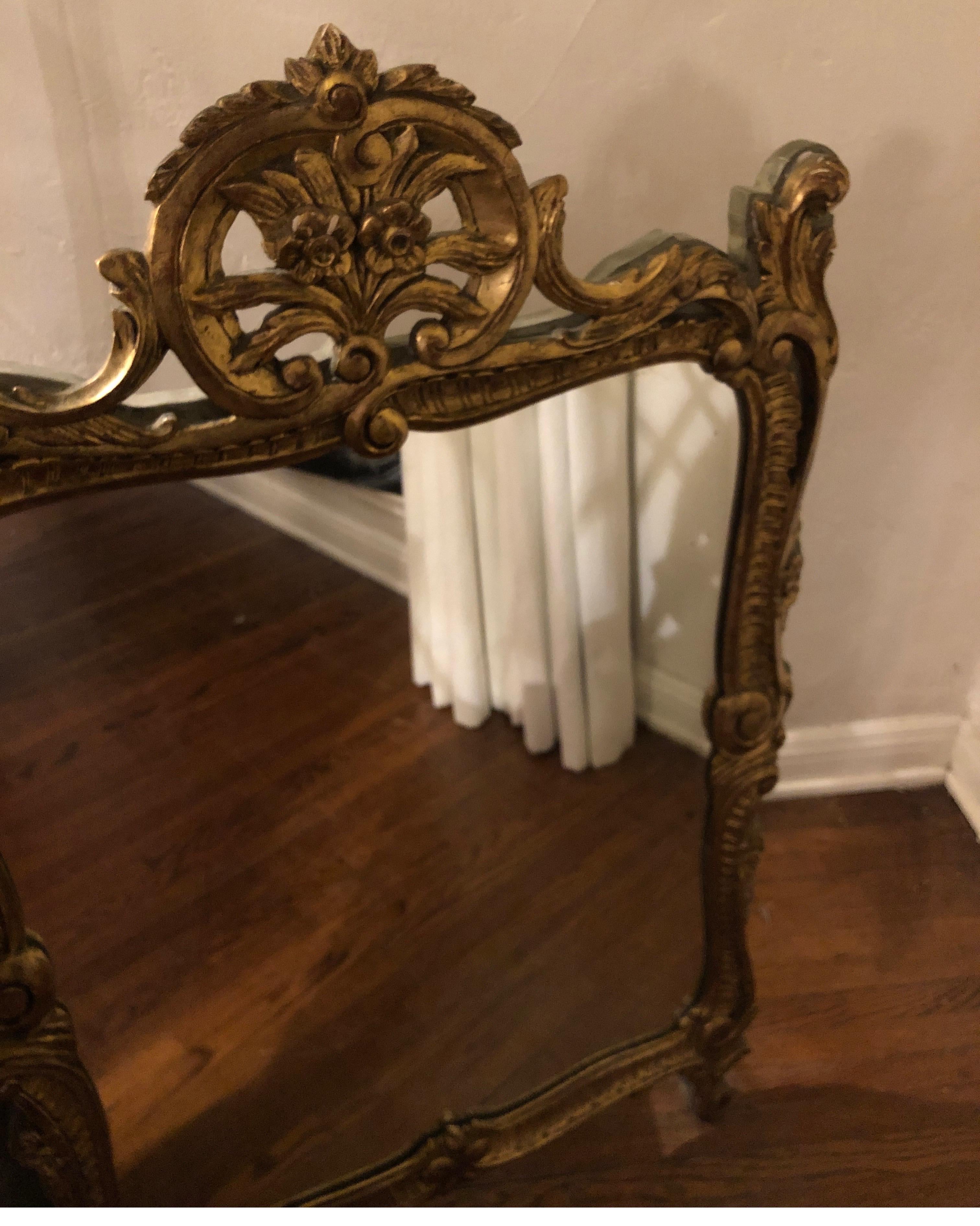 French 19th century gilded wood and plaster mirror. Gold with green painted trim. 
Beautiful patina

Measure approximate 39” height x 24” 2” depth.
 