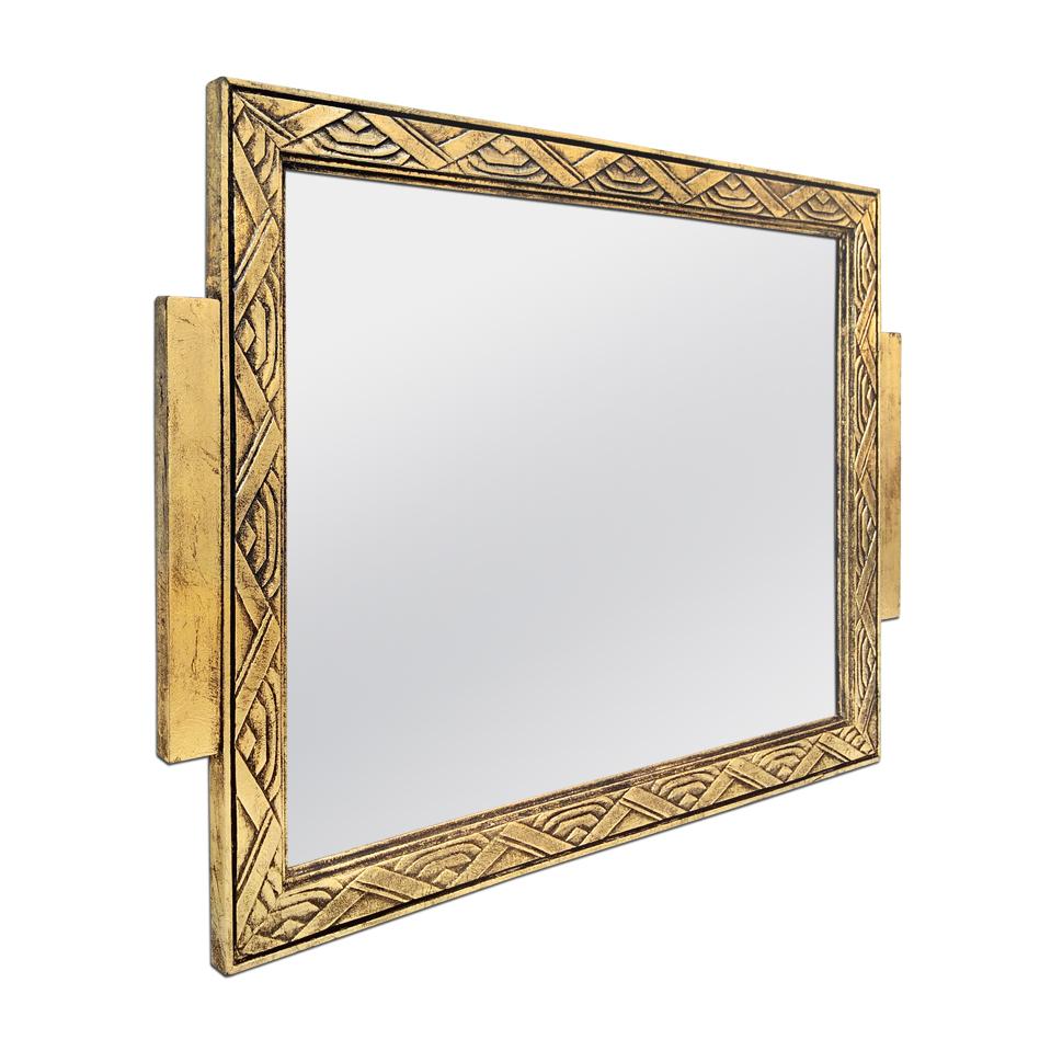 Antique carved giltwood mirror, geometrics decors Art Deco style, circa 1930. Re-gilding to the patinated leaf on carved wood (Measure: frame width 3 cm / 1.18 in). Modern glass mirror. Antique wood back.