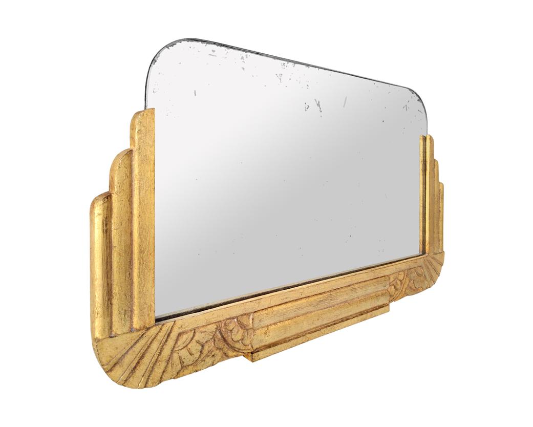 Antique carved giltwood mirror, Art Deco style. Re-gilding to the patinated leaf on carved oakwood (frame width: 5 cm / 1.97 in). Antique wood back. Original antique glass mirror.
