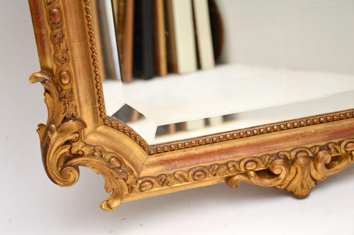 Miroir ancien en bois doré en vente 1