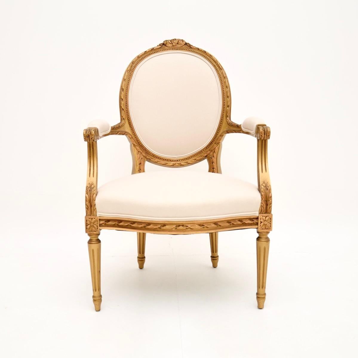 A beautiful and extremely well made antique French gilt wood salon chair. This was made in France, it dates from around the 1930’s.

The quality is superb, the frame has crisp and intricate carving throughout. It stands on fluted legs, has scrolled
