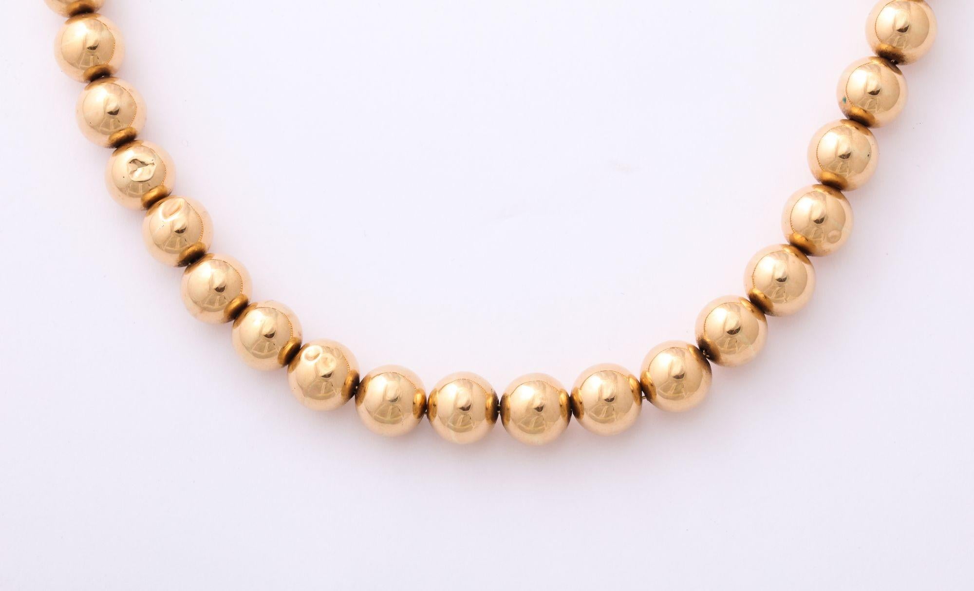 A wonderful 19th Century Gold Bead Necklace strung with gold chain and original clasp 