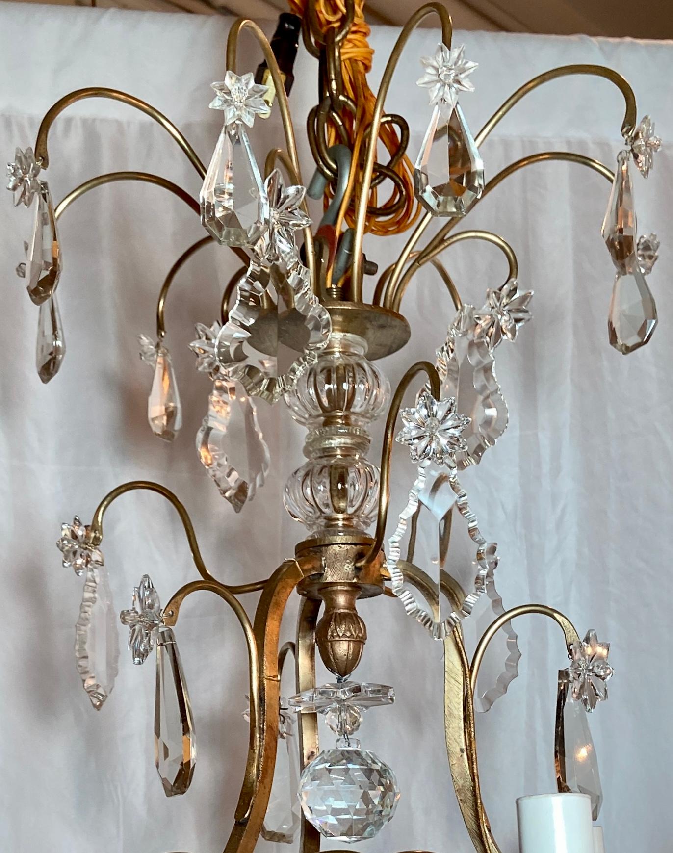 Antique French gold bronze and crystal chandelier, circa 1890.
This fixture has 6 lights and its openwork allows you to see the pretty form of the bronze. A nicely sized piece that will work in a variety of settings and still provide plenty of