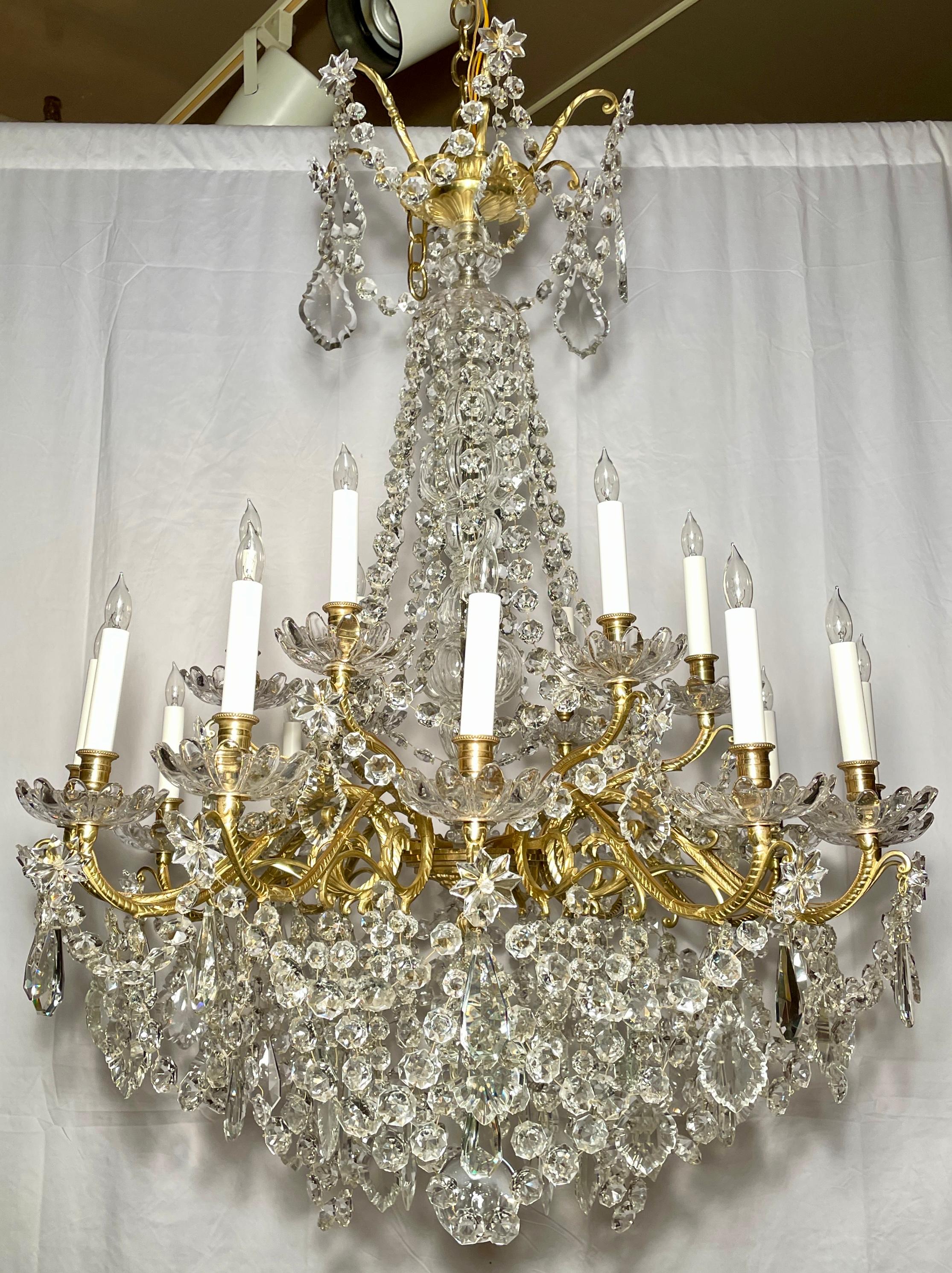 Antique French gold bronze and cut crystal 18-light chandelier, circa 1890s.