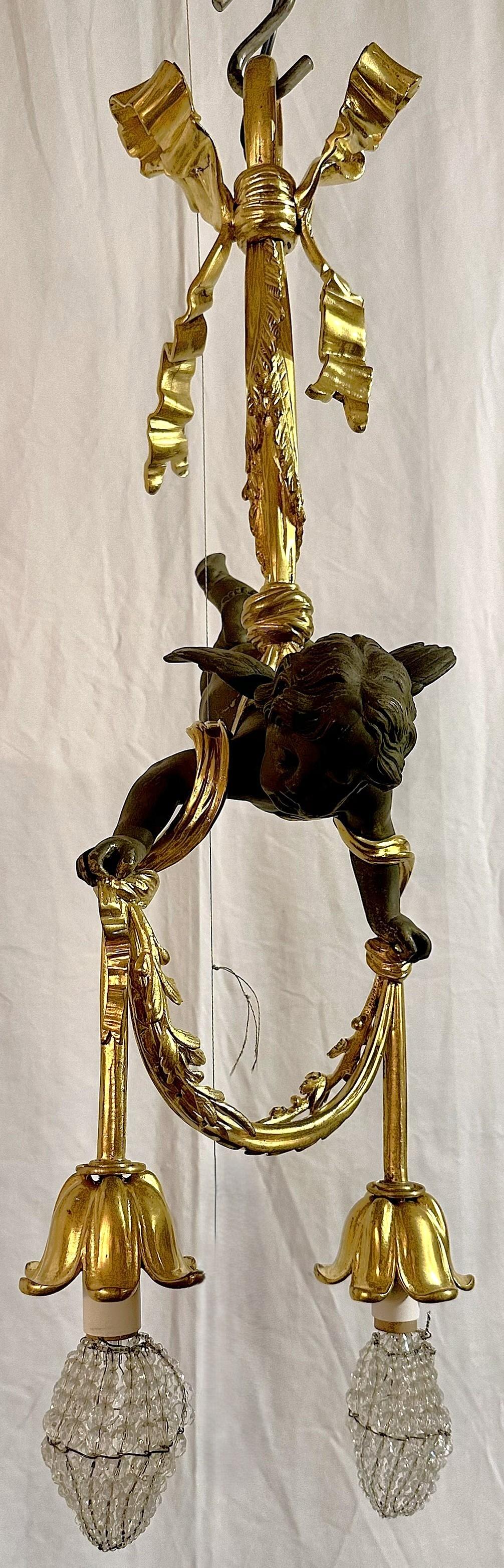 Antico lampadario francese in bronzo dorato e bronzo patinato 