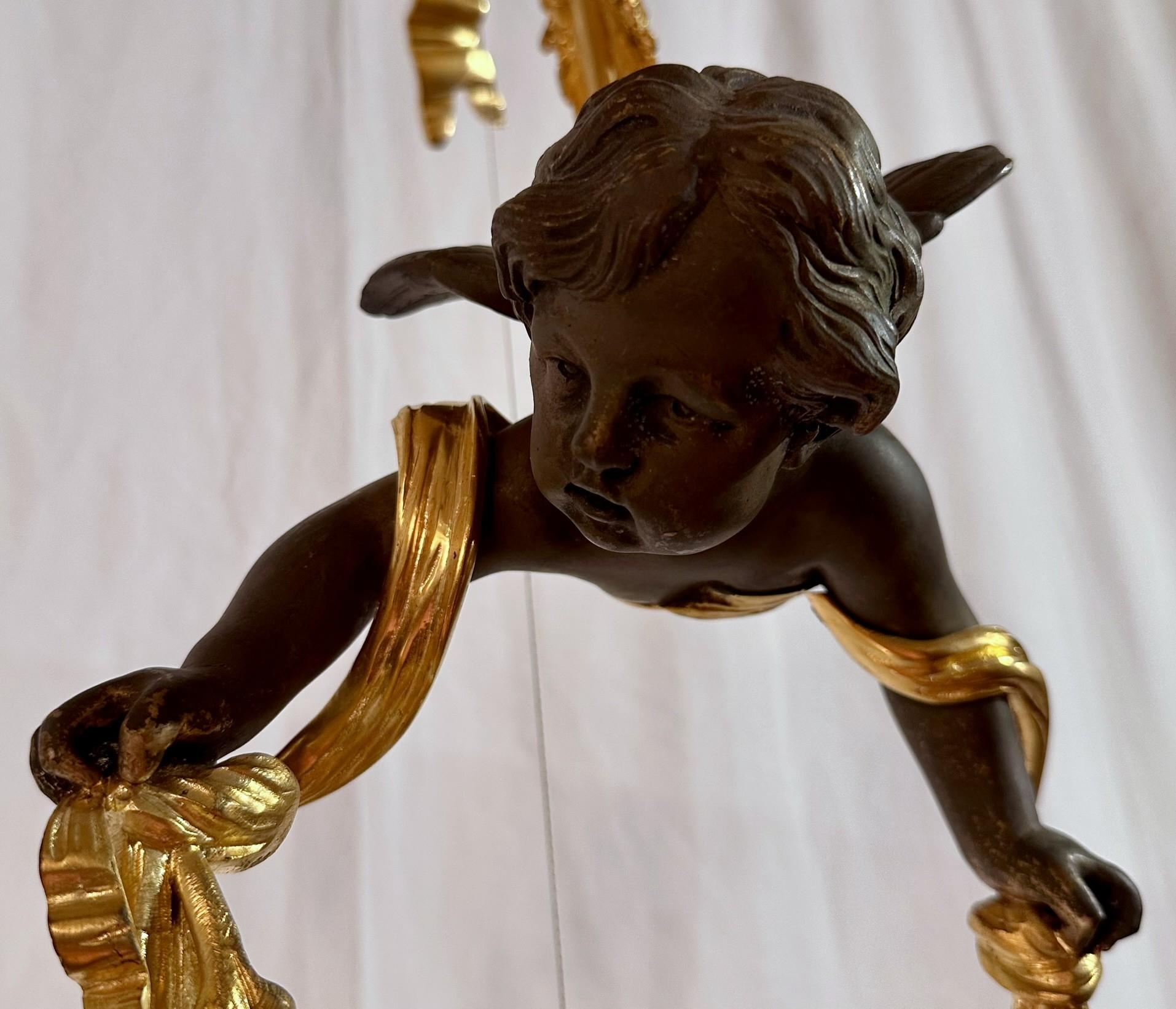 Antico lampadario francese in bronzo dorato e bronzo patinato 