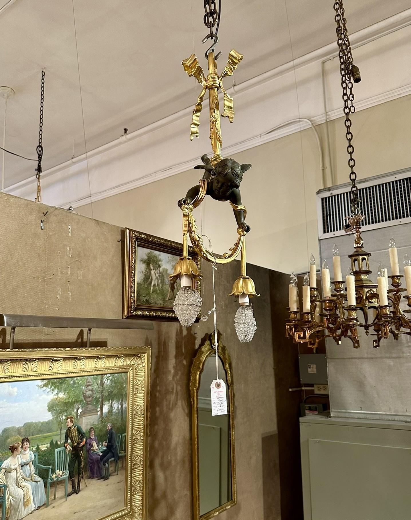Antico lampadario francese in bronzo dorato e bronzo patinato 