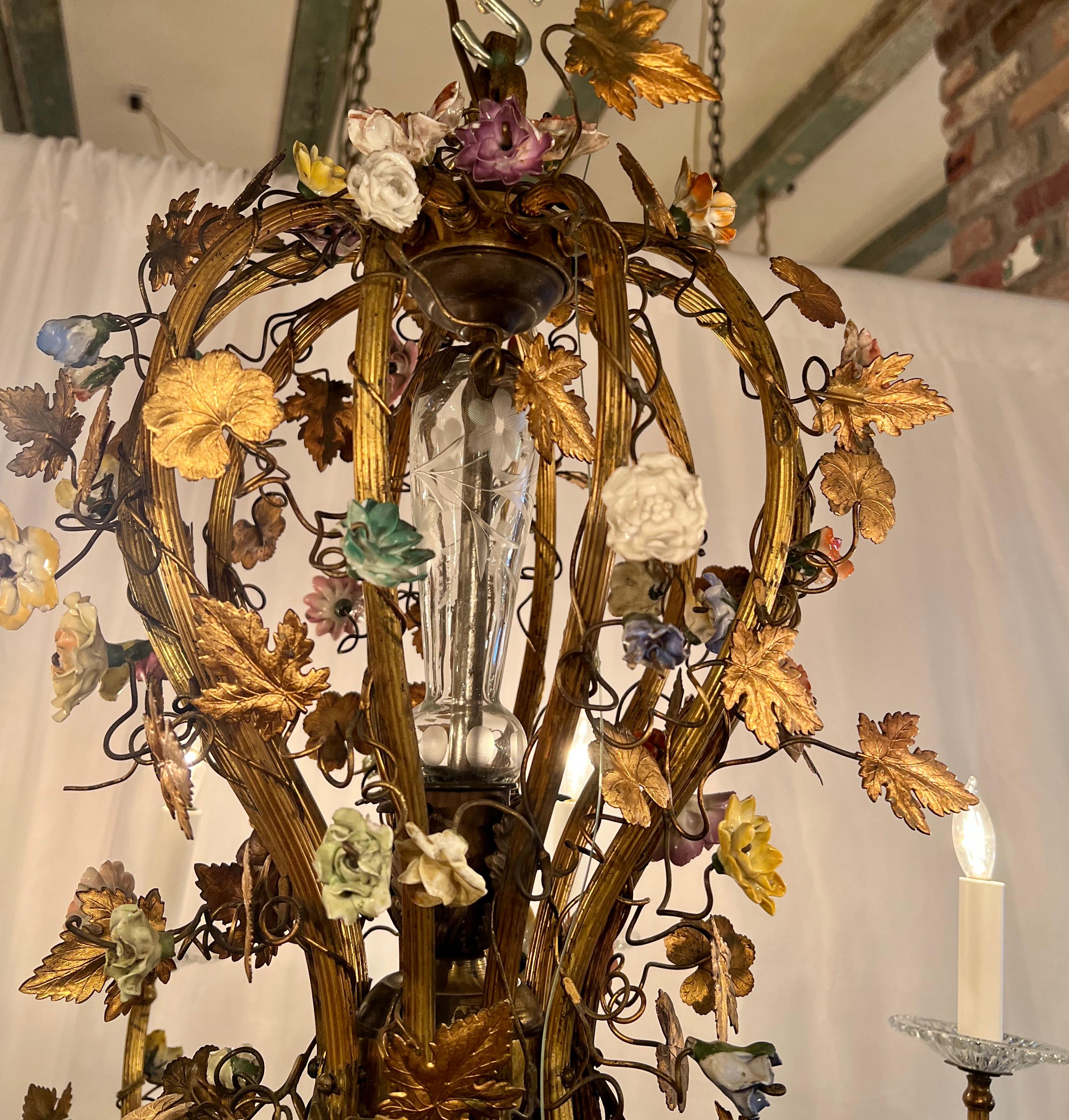 Antique French Gold Bronze and Cut Crystal Chandelier With Dresden Porcelain Flowers, Circa 1890.
10 Lights
