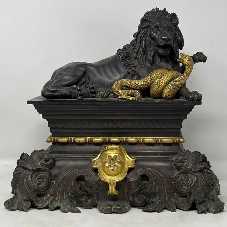 Antique French gold bronze and patinated bronze Lion & Serpent Andirons, Circa 1860.