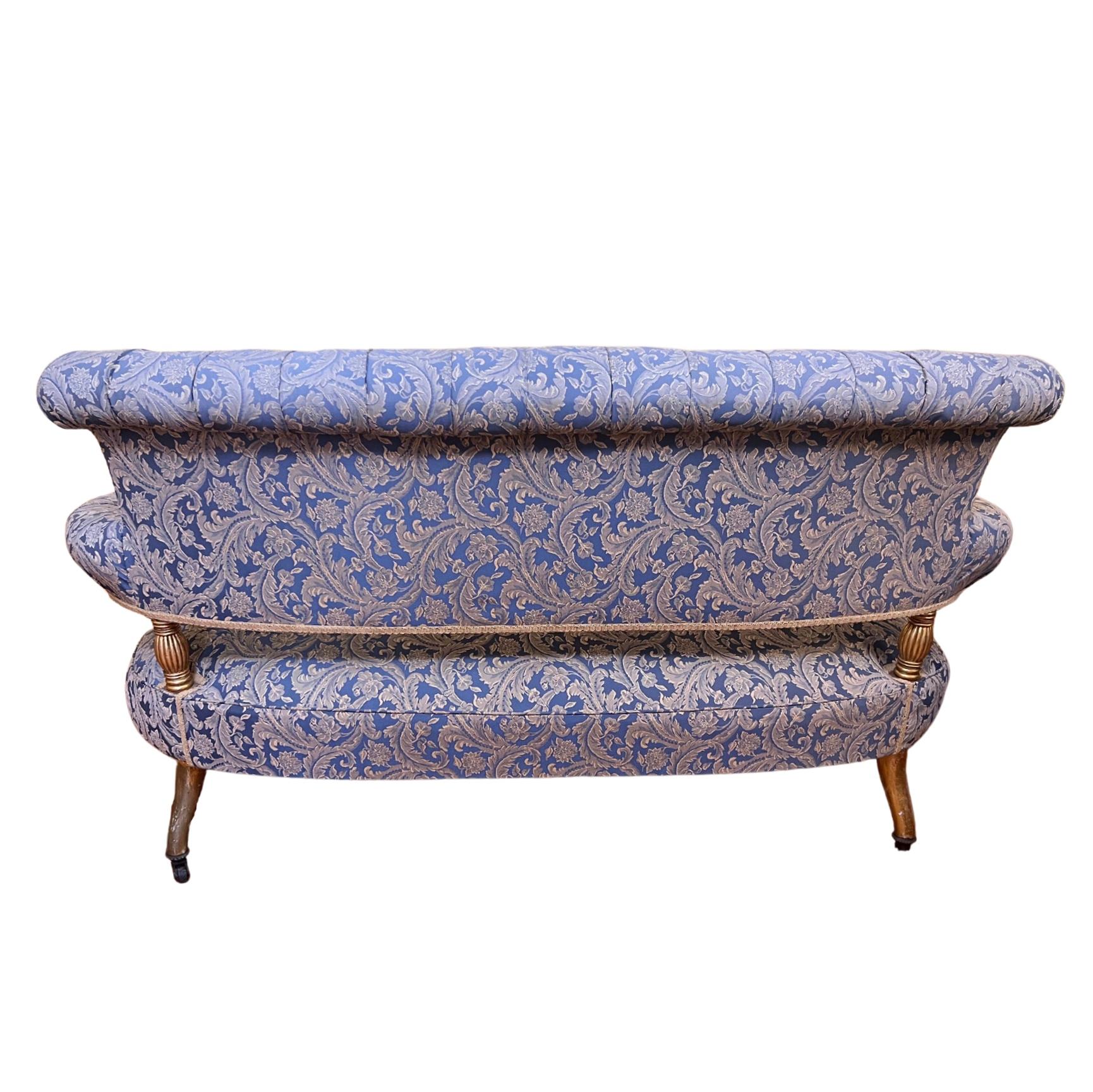 Button back blue cream brocade fabric, spring seat, padded armrests, carved detail on arm rest fronts, very elegant piece of furniture to add to your home, office or salon, all legs have original castors

Circa: 1880

Material: gold gilt and