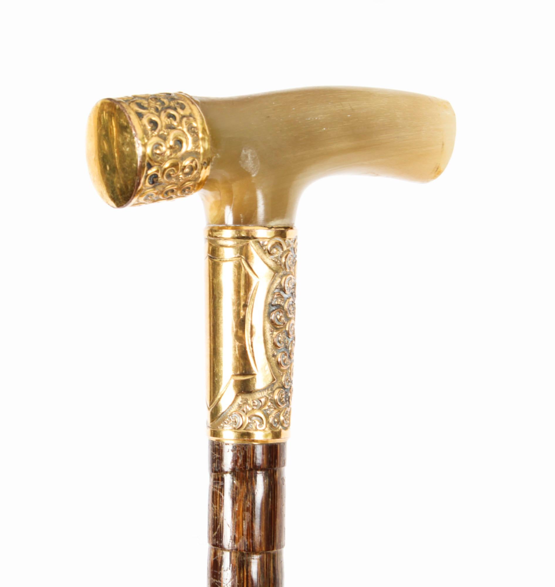 This is a fantastic antique French gentleman's walking stick with a very decorative horn and gold mounted handle, late 19th century in date.
 
It has a very decorative horn handle with gold mounts on a tapered bamboo shaft, and it features the