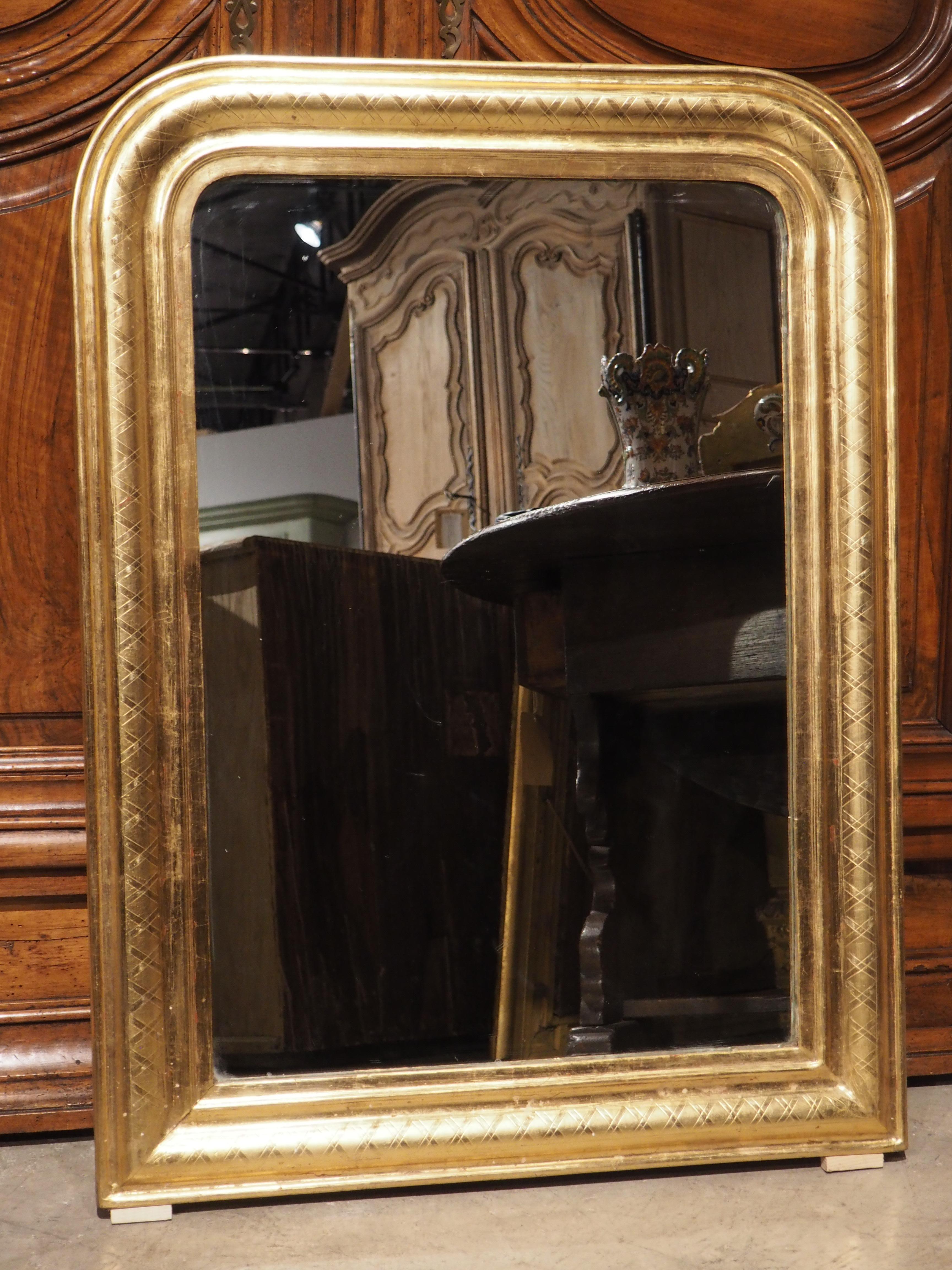 This versatile antique French Louis Philippe style mirror with clean lines is over 100 years old and can still be used with almost any style of furnishing. Louis Philippe mirrors were made from the middle of the 1800s through the last half of the