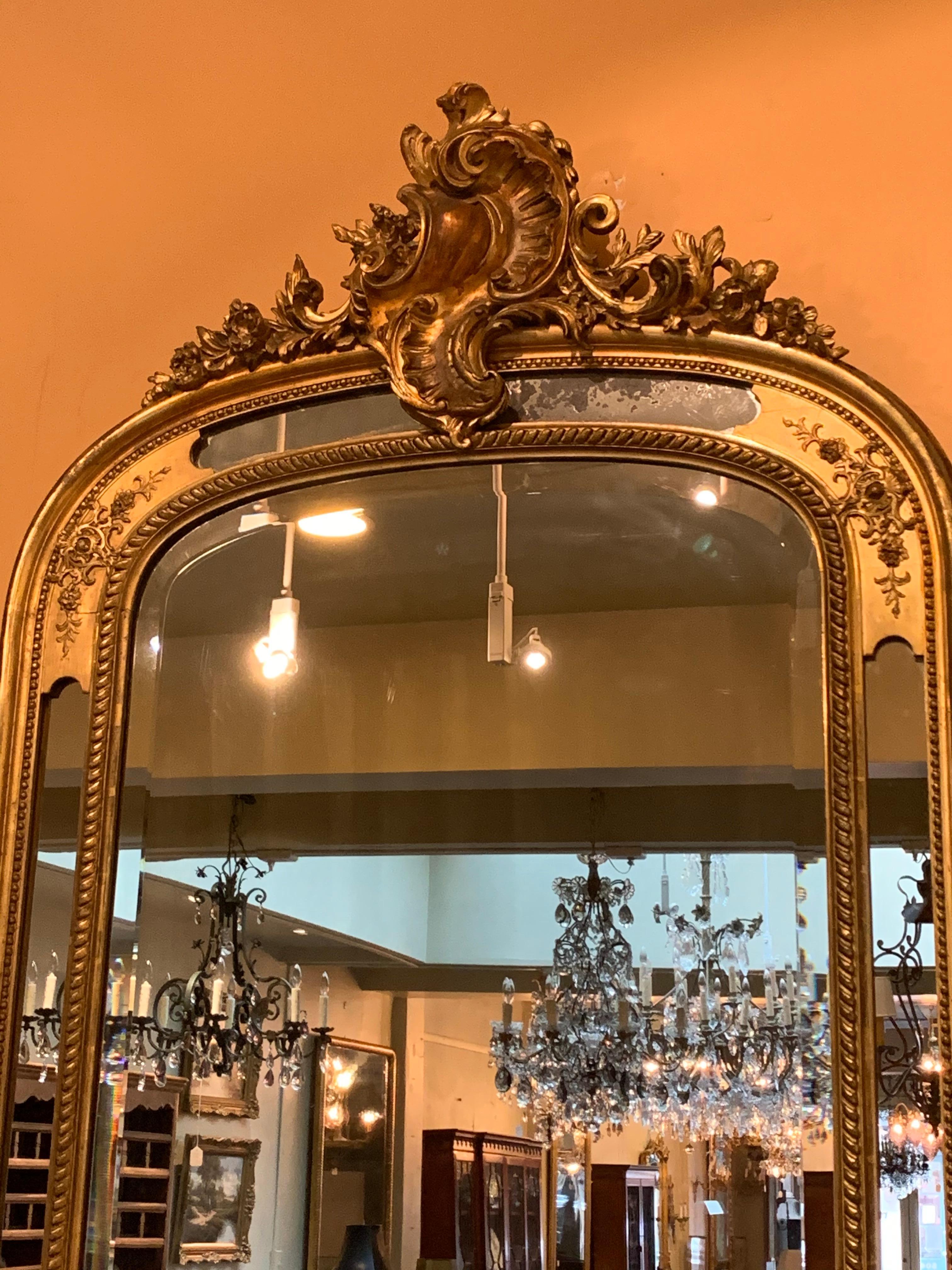 Antique French gold leaf mirror, paneled.