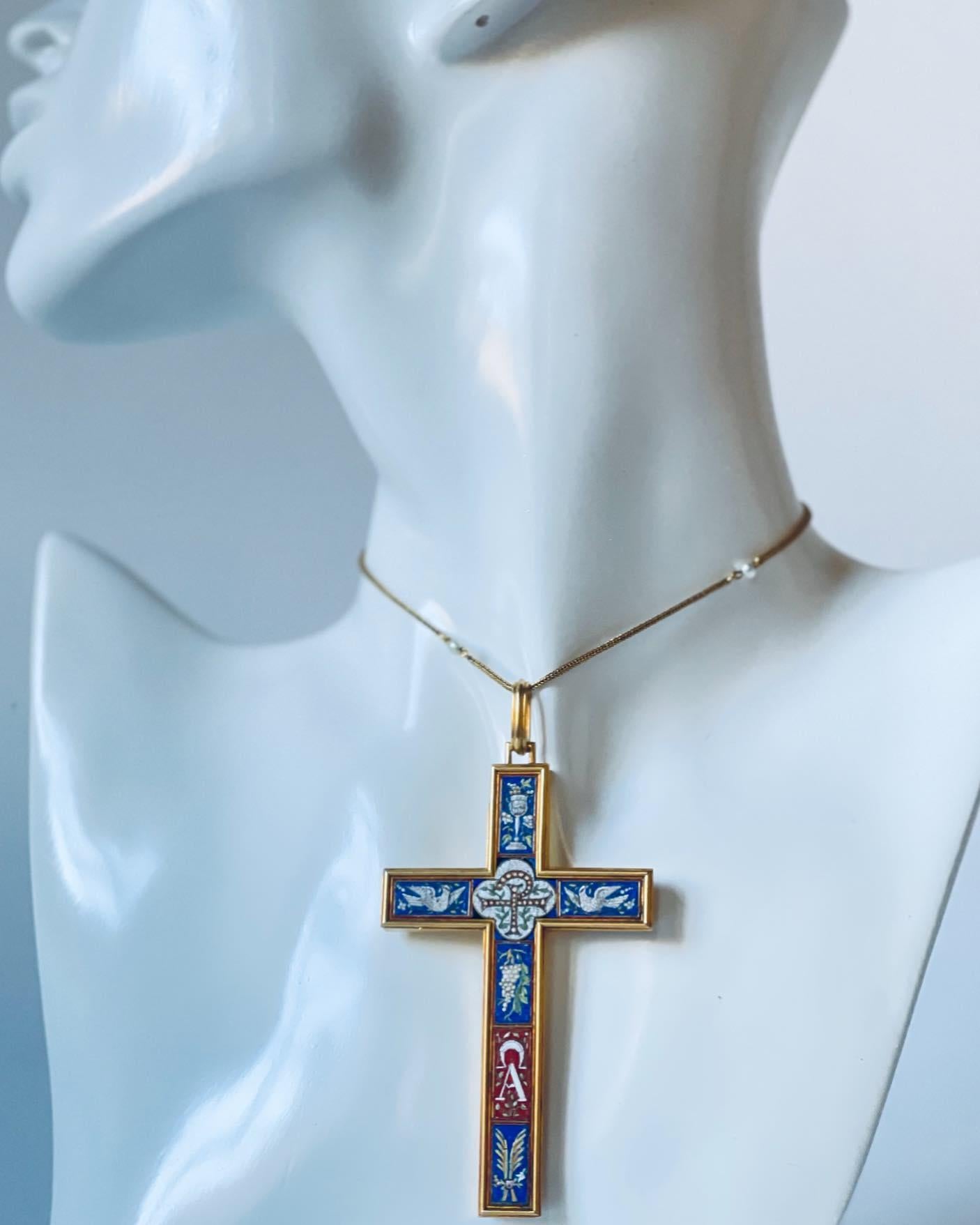 A wonderful 19th Century French micromosaic cross pendant in 18K yellow gold. The cross features a nicely detailed micromosaic inlay of a staurogram symbol in the centre, the Alpha & Omega symbols at the bottom, and a white dove of peace to either