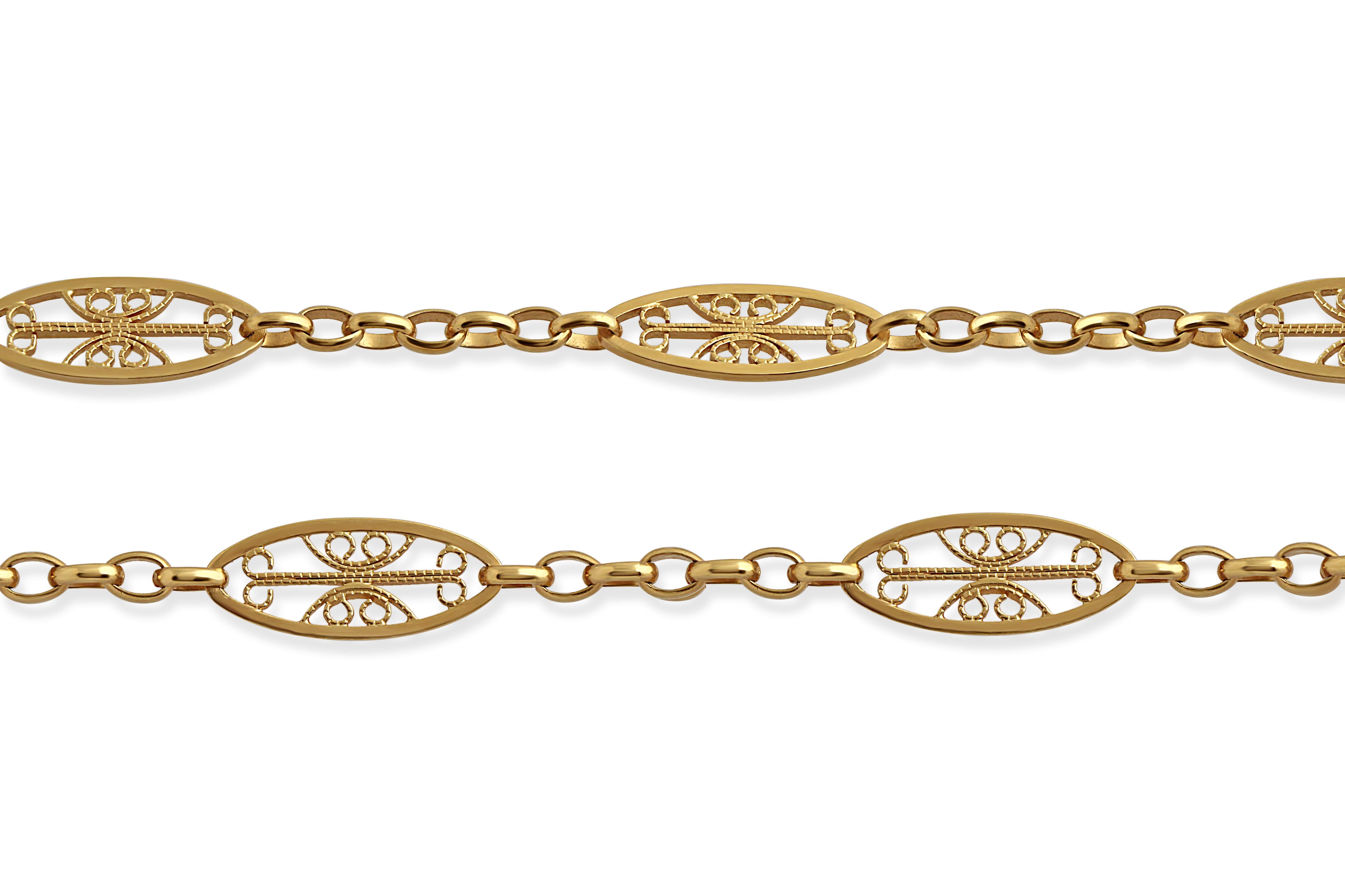 An antique French gold sautoir, made up of openwork filigree links. Length = 60cm. Weight = 19.50gr.

