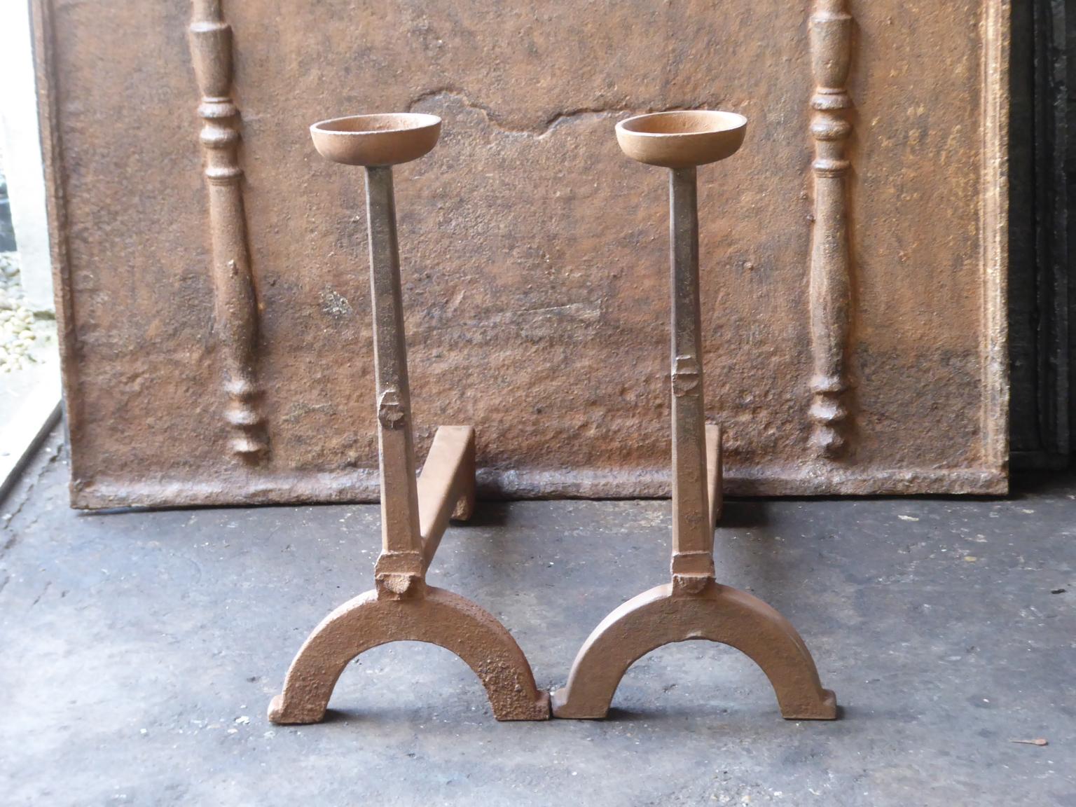 17th century French andirons made of cast iron. The style of the andirons is Gothic. They are in a good condition.